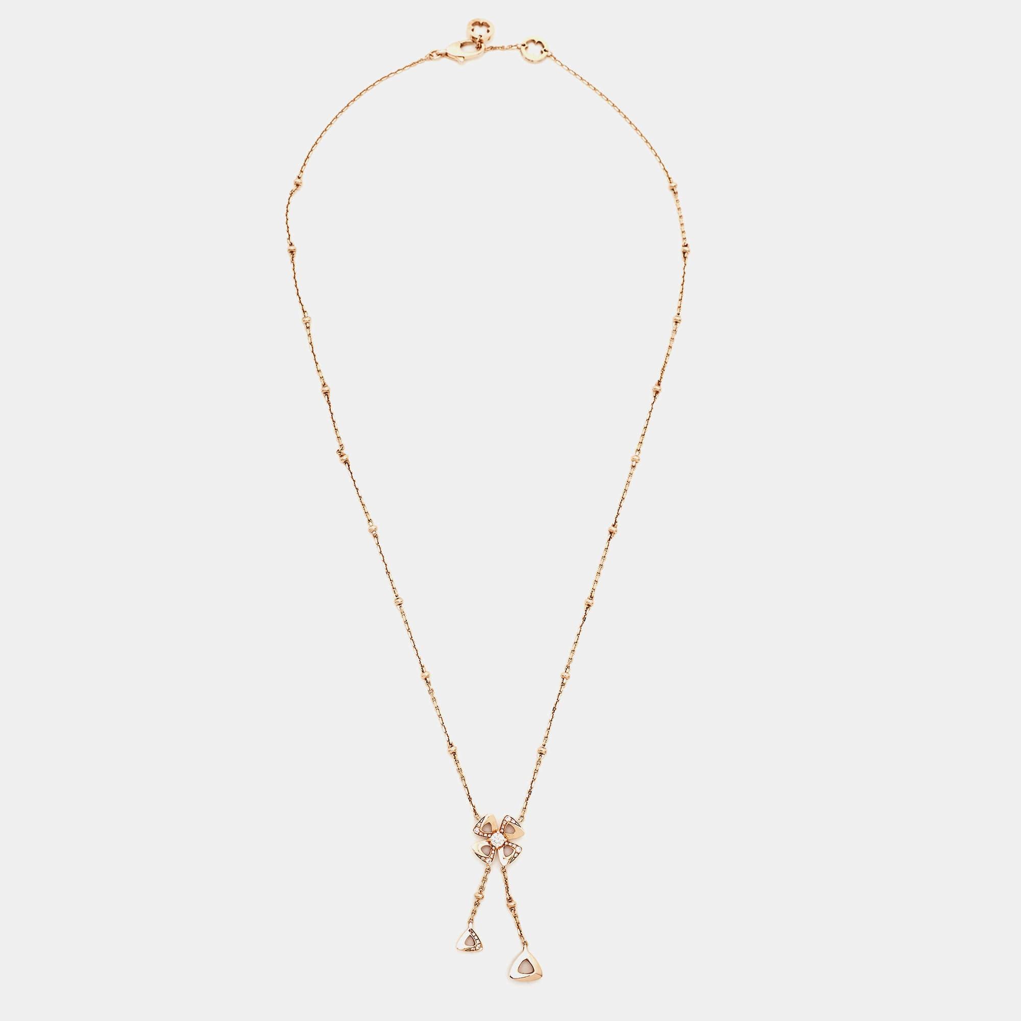 The Bvlgari Fiorever necklace is a captivating piece of jewelry that exudes elegance. Crafted in exquisite 18K rose gold, it features a delicate chain adorned with a dazzling flower-shaped pendant. The pendant is embellished with brilliant diamonds,