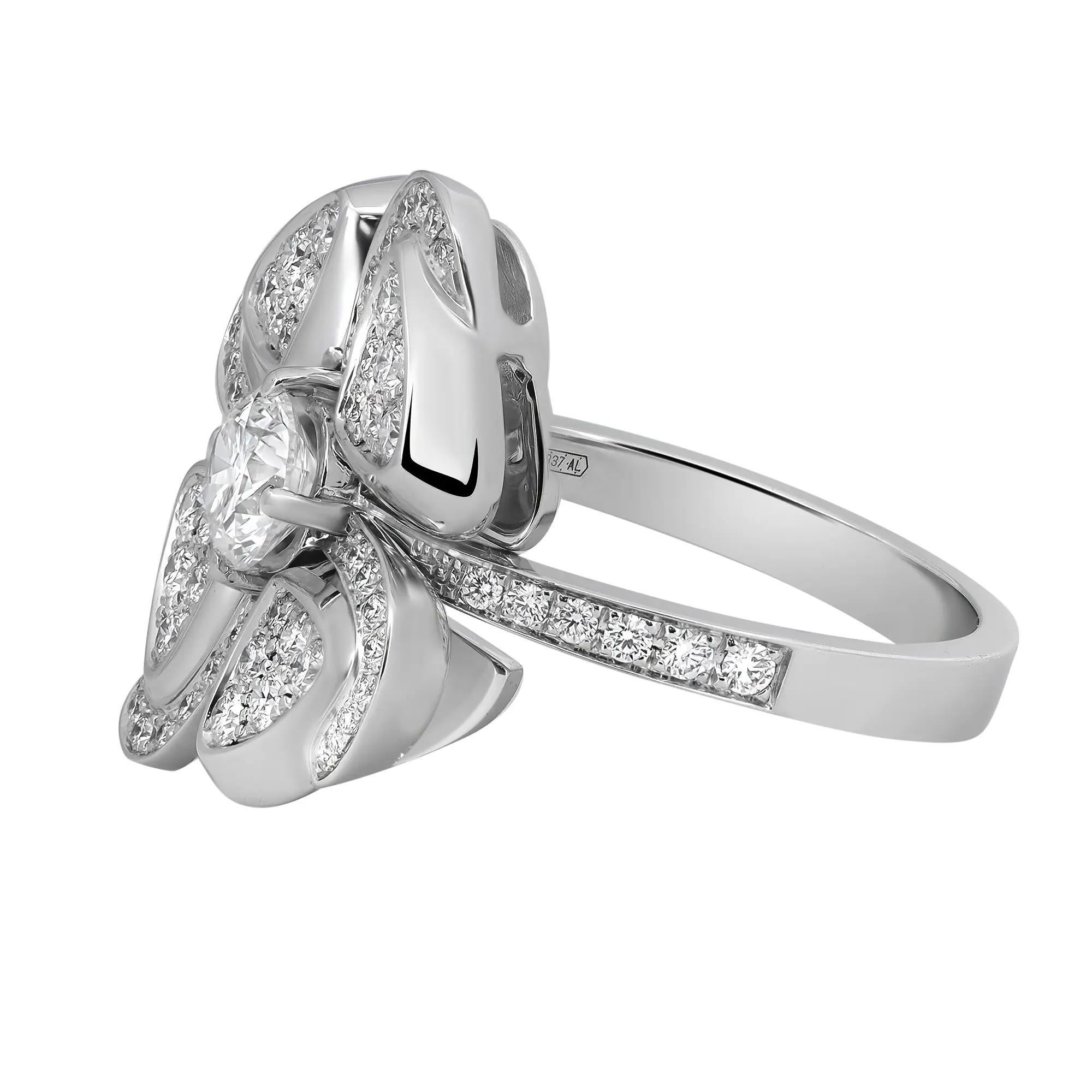 Fall in love with this beautiful Blvgari Fiorever diamond ring. Crafted in lustrous 18K white gold. It features a center prong set round brilliant cut diamond embraced with Bvlgari’s precious floral icon sparkling eternally with four white gold and