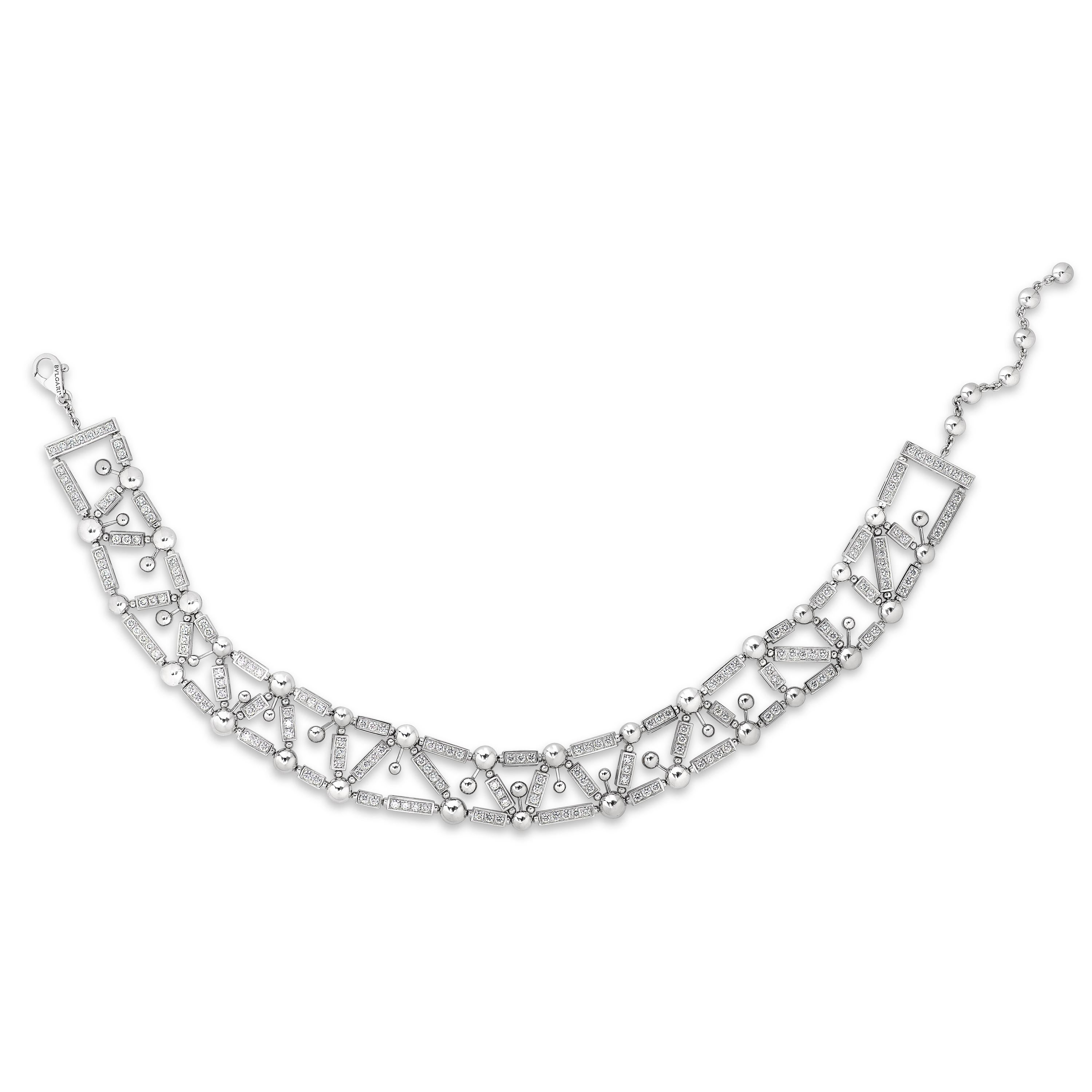 Bvlgari Fireworks collection diamond choker necklace and diamond bracelet set in 18 karat white gold. 

The choker necklace from this suite contains 185 round diamonds weighing approximately 9.25 carats with F-G color and VS clarity.  It weighs