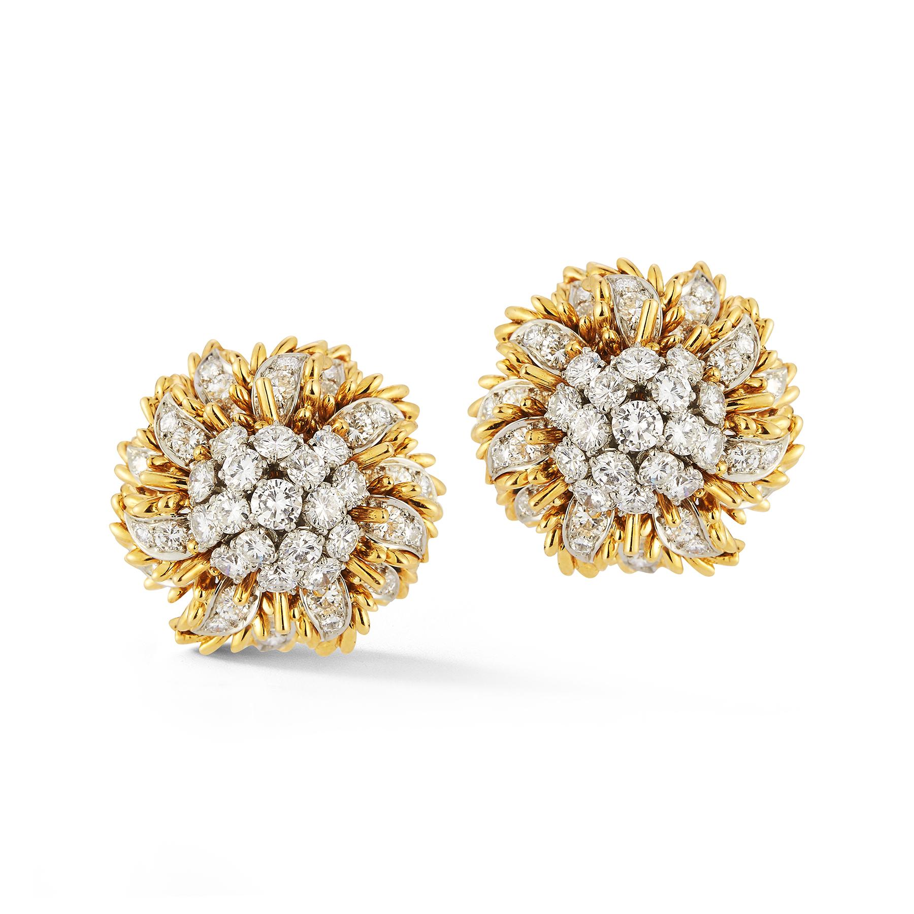 Bulgari Floral Gold & Diamond Earrings 

Features a stunning array of diamonds set in 18k gold with a floral design.
 
Signed Bvlgari