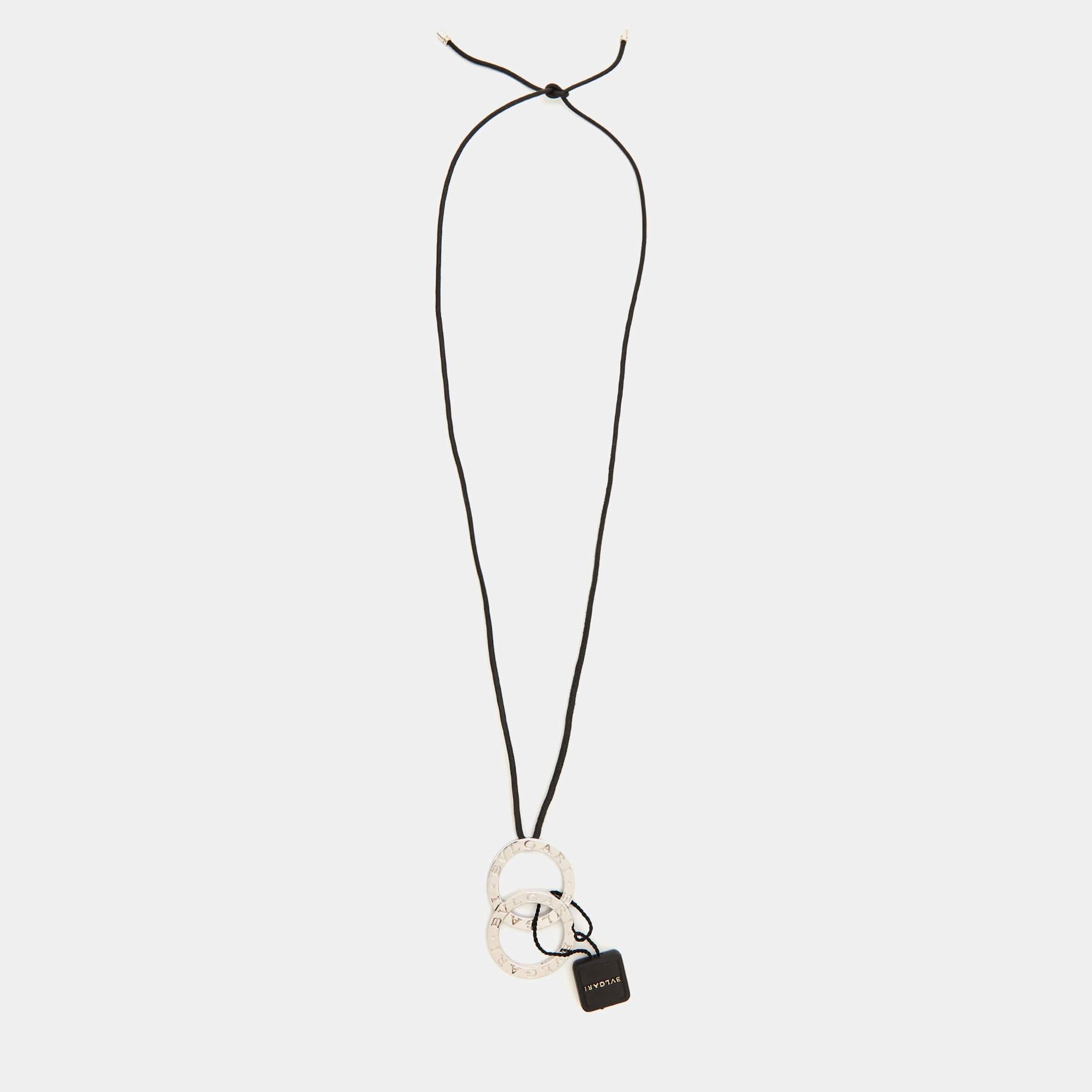 The Bvlgari Fortuna Grande is an exquisite necklace featuring a classy design. It showcases a sterling silver pendant with the iconic Bvlgari logo and a black cord holding it, creating an accessory you can wear with T-shirts to dresses.

