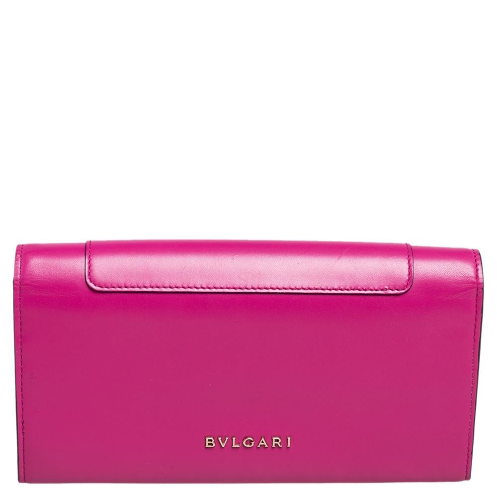 How lovely is this fuchsia Bvlgari wallet! Every accent on it is appealing and high in style, like the smooth leather exterior and the Serpent head on the front flap which opens to reveal multiple slots and a zip compartment.

Includes: Original Box