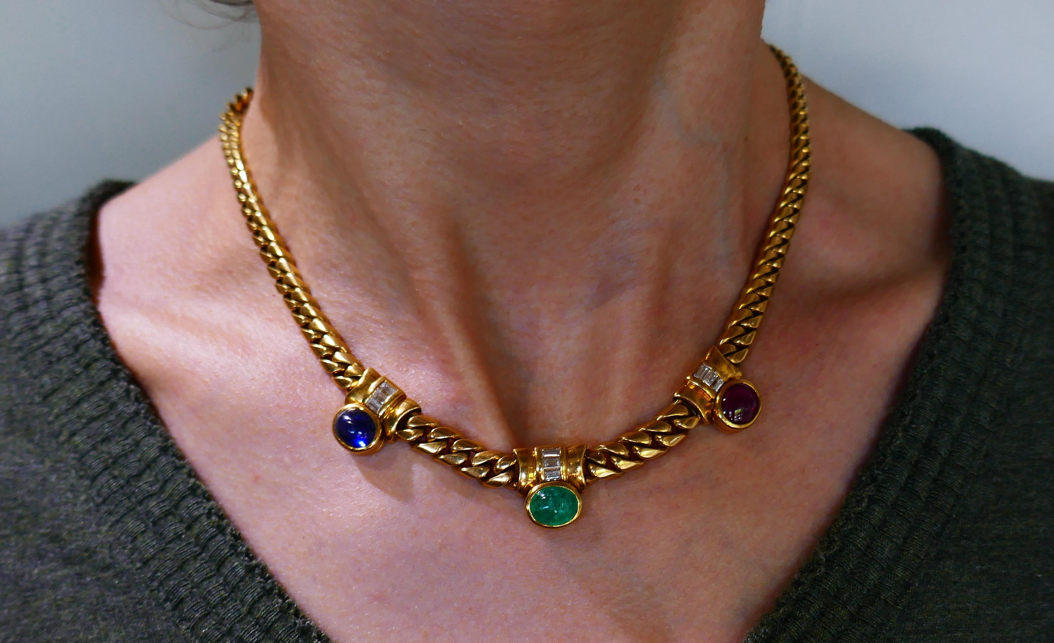 Elegant and stylish chain necklace created by Bulgari in Italy in the 1970s. Colorful and wearable, the necklace is a perfect choice for almost any outfit.
It is made of 18 karat yellow gold and set with cabochon ruby, emerald and sapphire. 
The