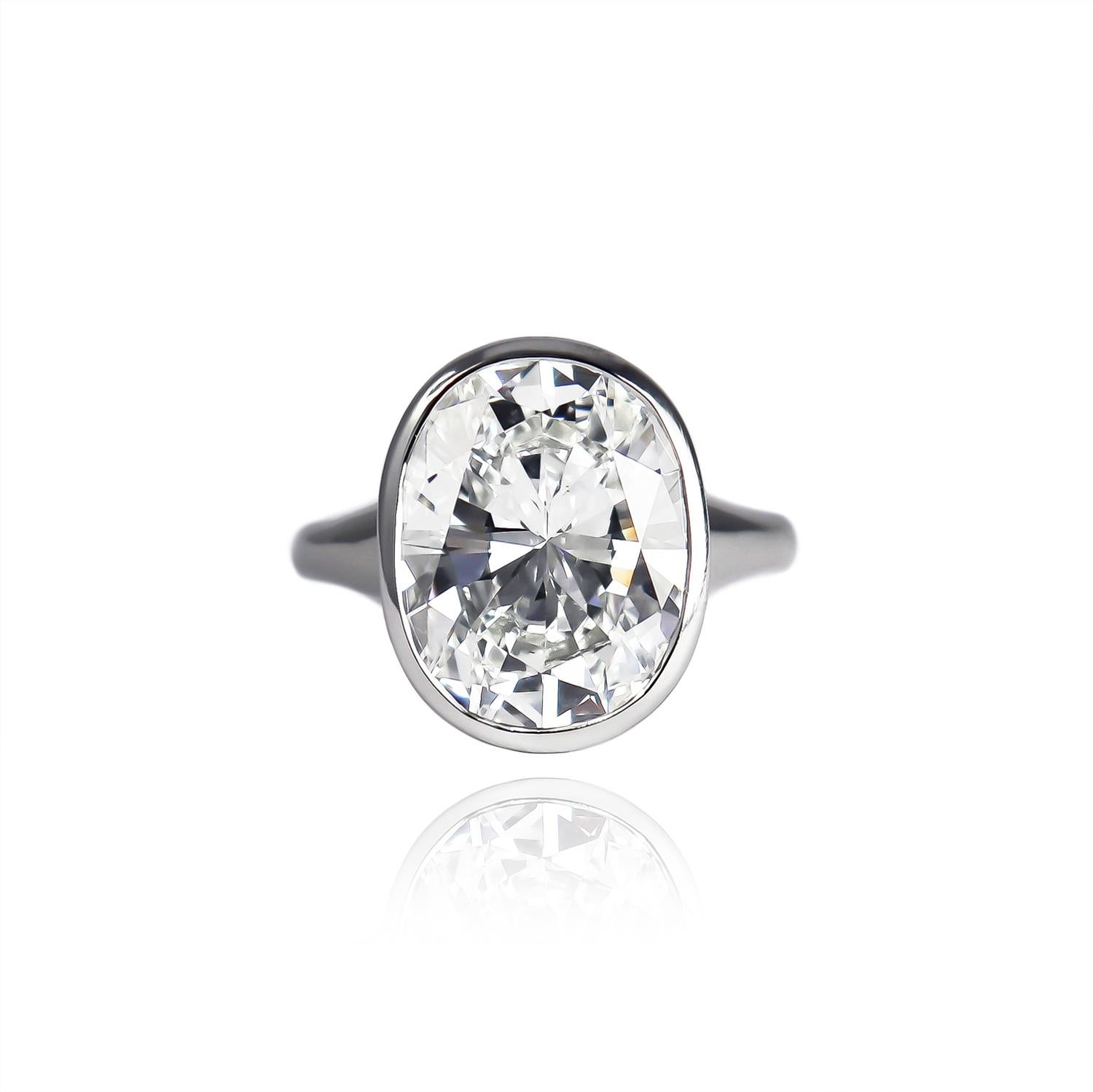 This contemporary and fierce ring from the house of BVLGARI features a GIA certified 6.50 carat oval brilliant cut diamond of H color and VS1 clarity. Set in a refined and crisp bezel mounting, this diamond possesses an elegant and shapely outline