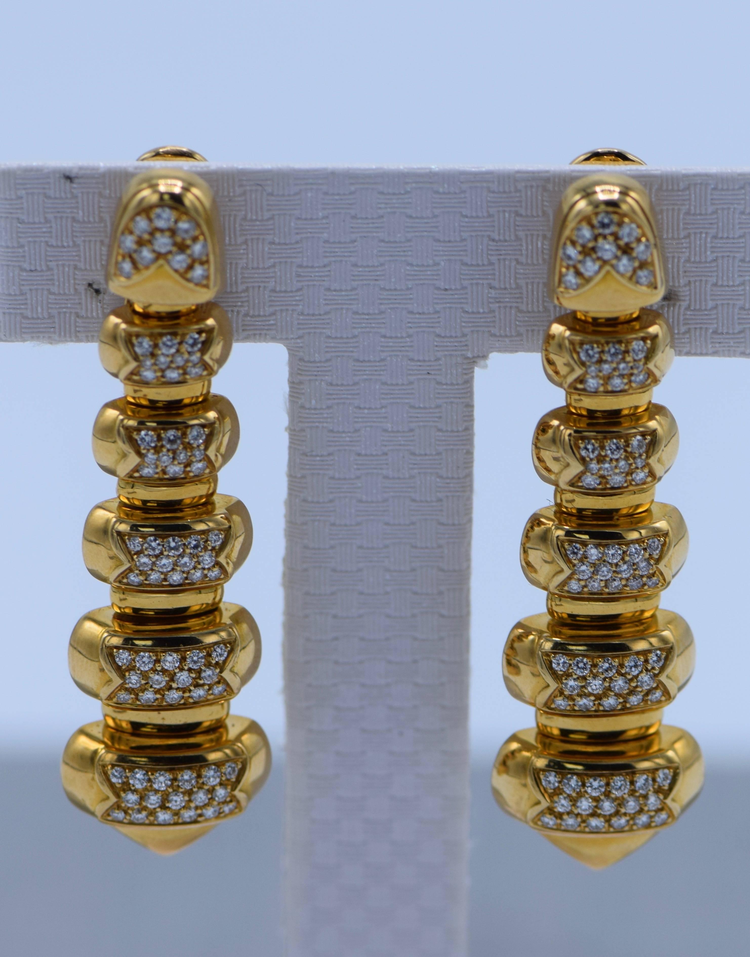 18k Gold Clip-on Earrings 

Diamond weight: 3 Carat 

18 kt., composed of graduated rounded rectangular bombé panels pavé-set with round diamonds approximately 3 cts., spaced by polished bar links, signed Bulgari, approximately 25 dwts. 

Diamonds:
