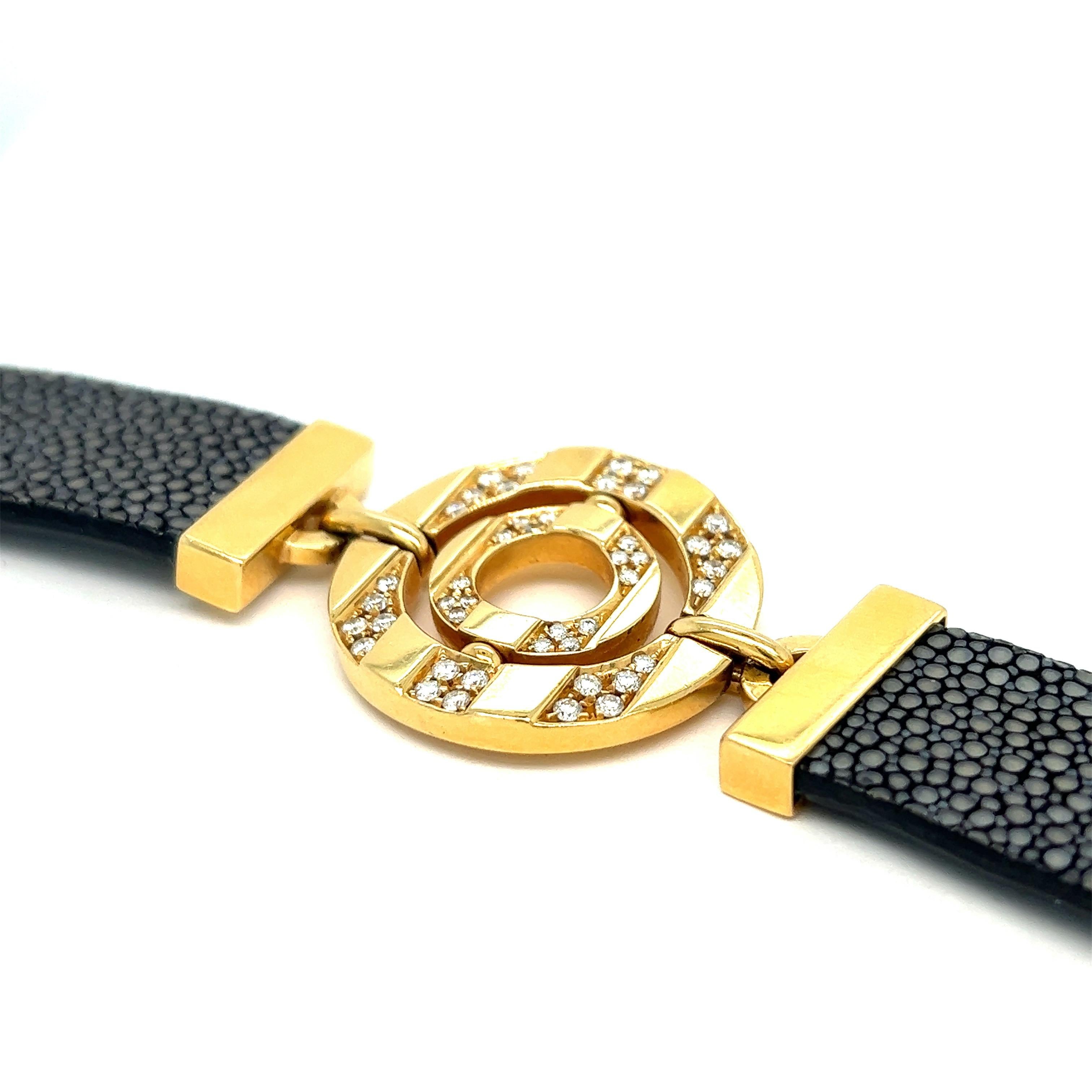 Bvlgari gold diamond leather bracelet

Round-cut diamonds, black leather straps, 18 karat yellow gold; marked Bvlgari, Made in Italy, 750

Size: width 1.13 inches, length 8.25 inches
Total weight: 48.2 grams 