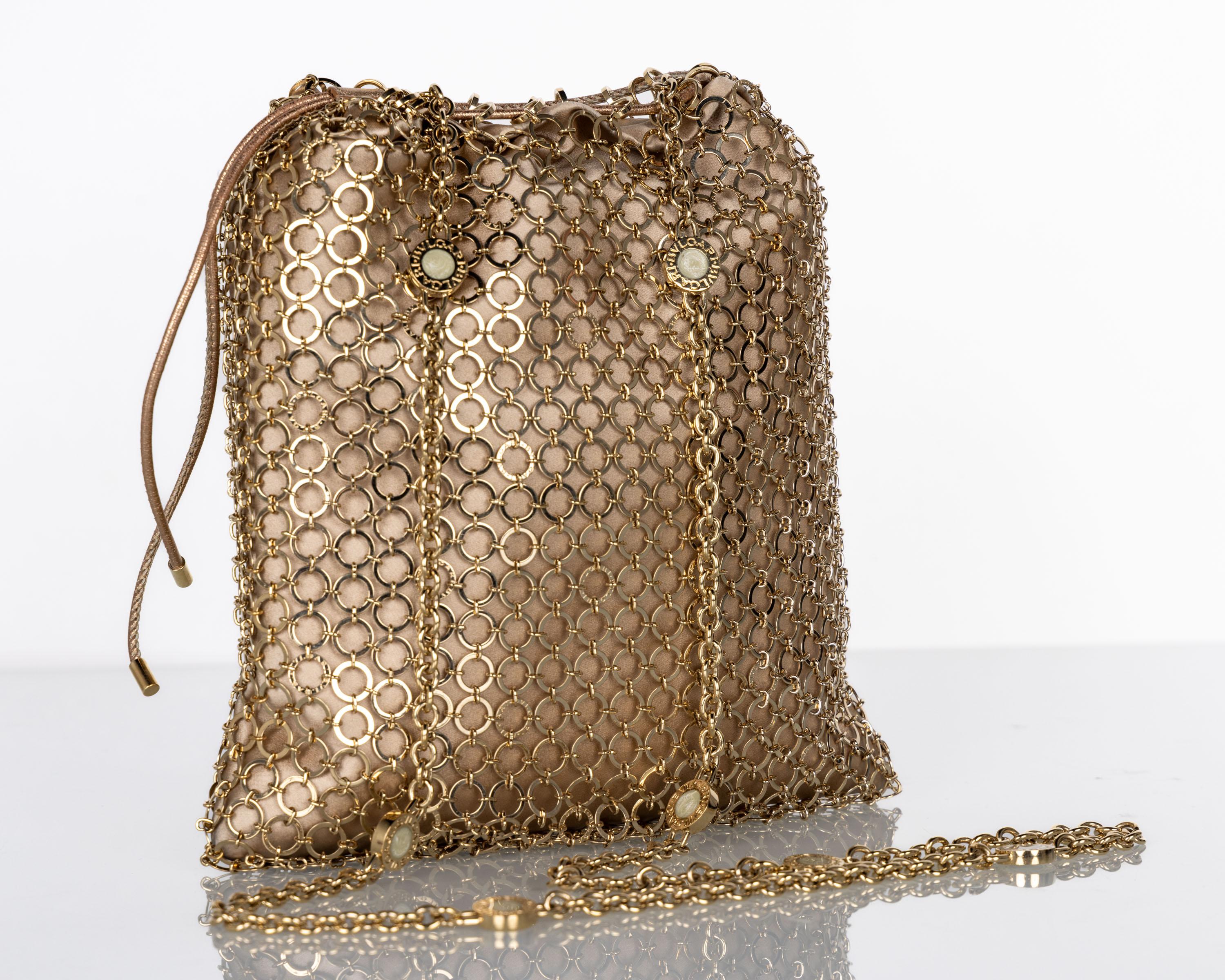 Bulgari—stylized as BVLGARI— was founded in 1884 by Sotir Bulgari in Rome. Unlike many luxury brands, Bulgari curates luxury across several markets and is also most noted for their bag designs 
This Bulgari gold mesh cross body/ shoulder bag is done