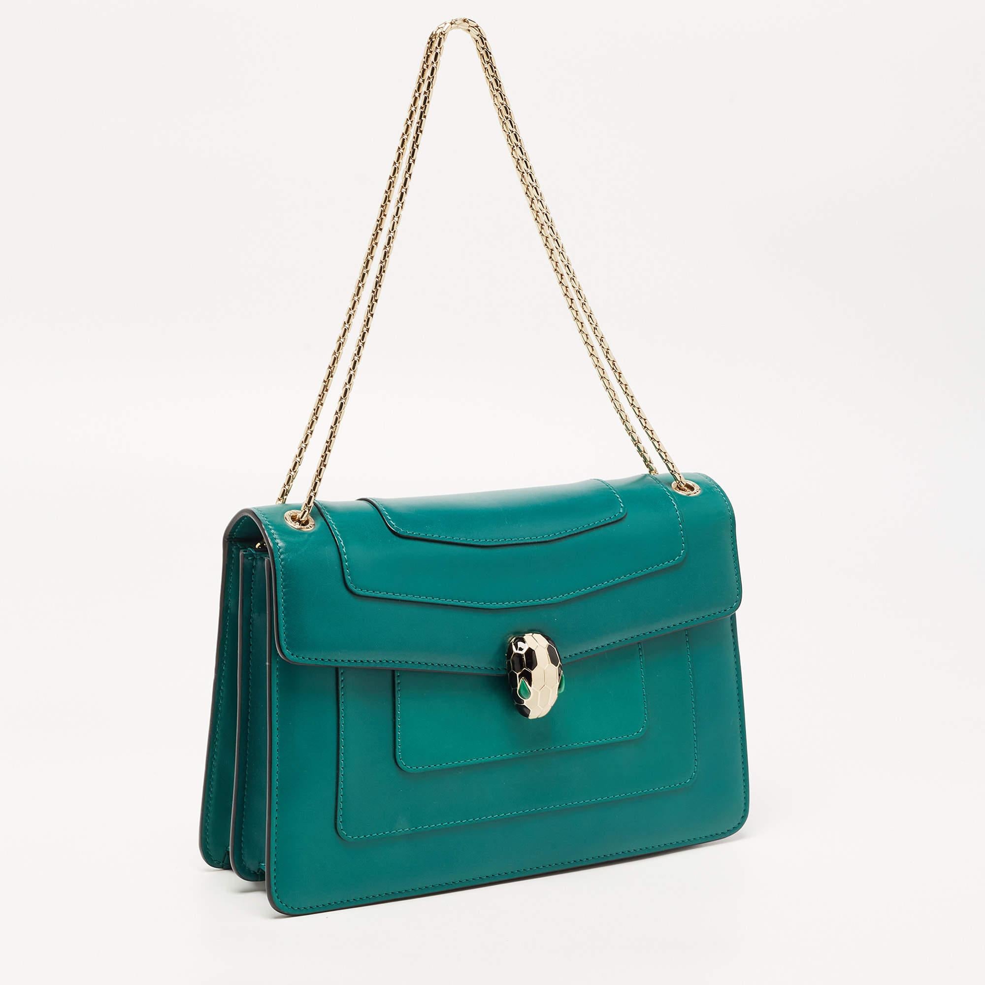Most designs from Bvlgari with their striking elements, pay tribute to the Roman roots, and this bag is no different. Made from leather, it is an accessory of utility and luxury. Lined with fabric and leather, the interior has enough room to