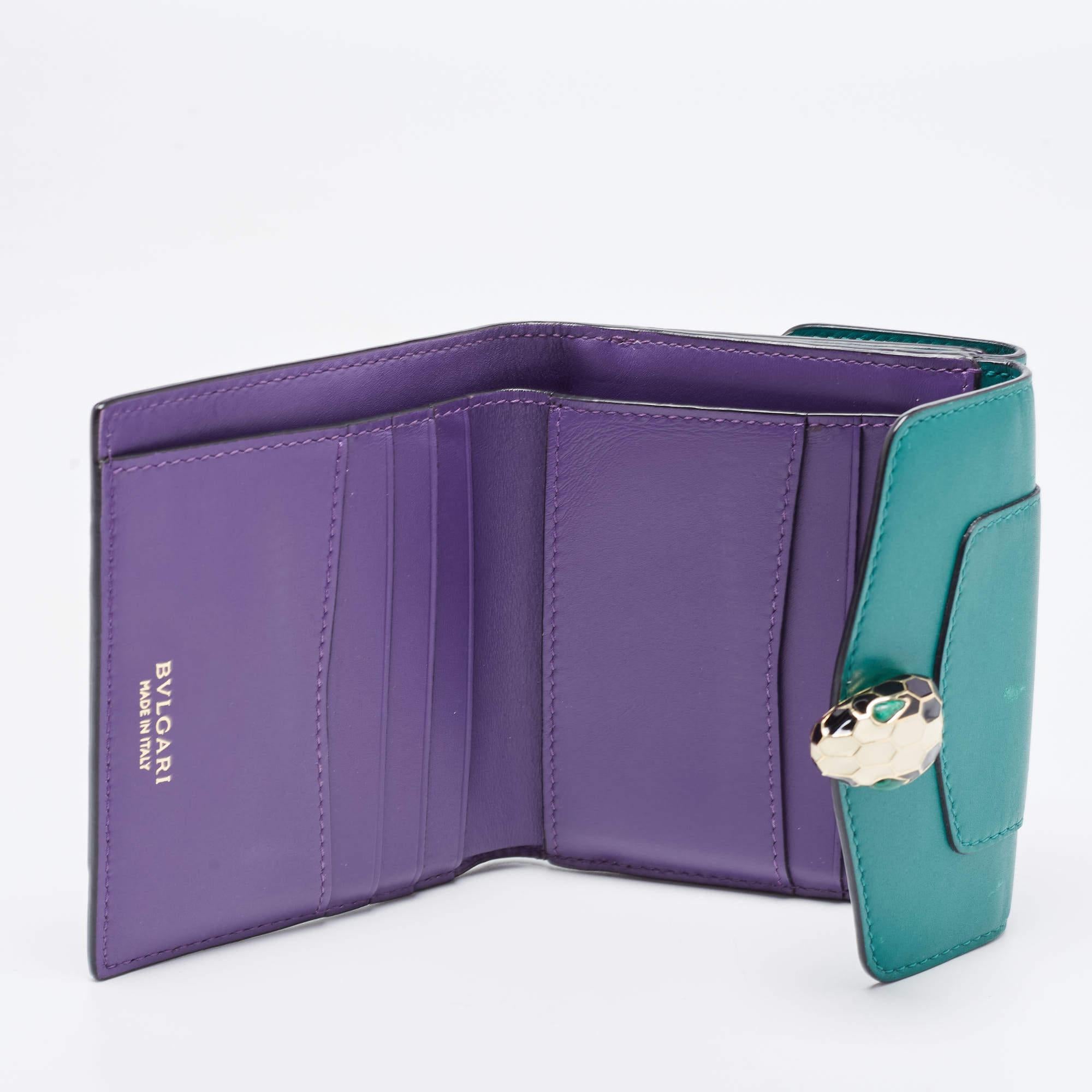 How lovely is this green Bvlgari wallet! Every accent on it is appealing and high in style, like the smooth leather exterior and the Serpent head on the front flap which opens to reveal multiple slots. This compact wallet has a flap pocket to the