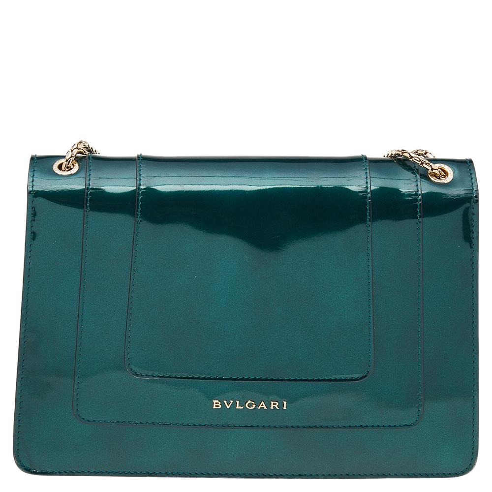 Add a dazzling element to your style with this stunning Bvlgari creation. Crafted from patent leather in a green hue, the shoulder bag is styled with a flap that has the iconic Serpenti head closure. The bag has a fabric interior and a gorgeous