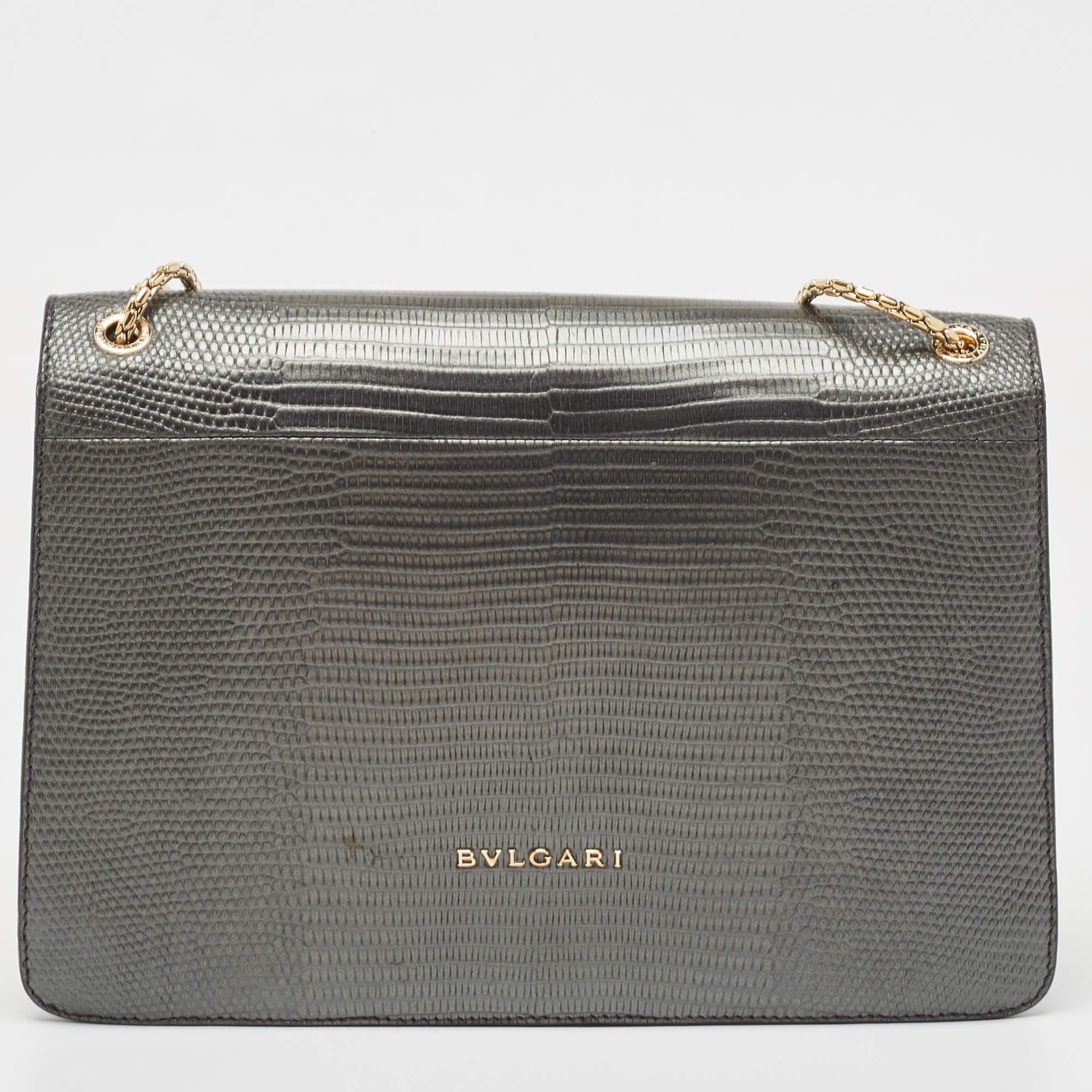 Most designs from Bvlgari, with their striking elements, pay tribute to the Roman roots, and this bag is no different. Made from Karung leather, it is an accessory of utility and luxury. Perfectly sized, the interior has enough room to dutifully
