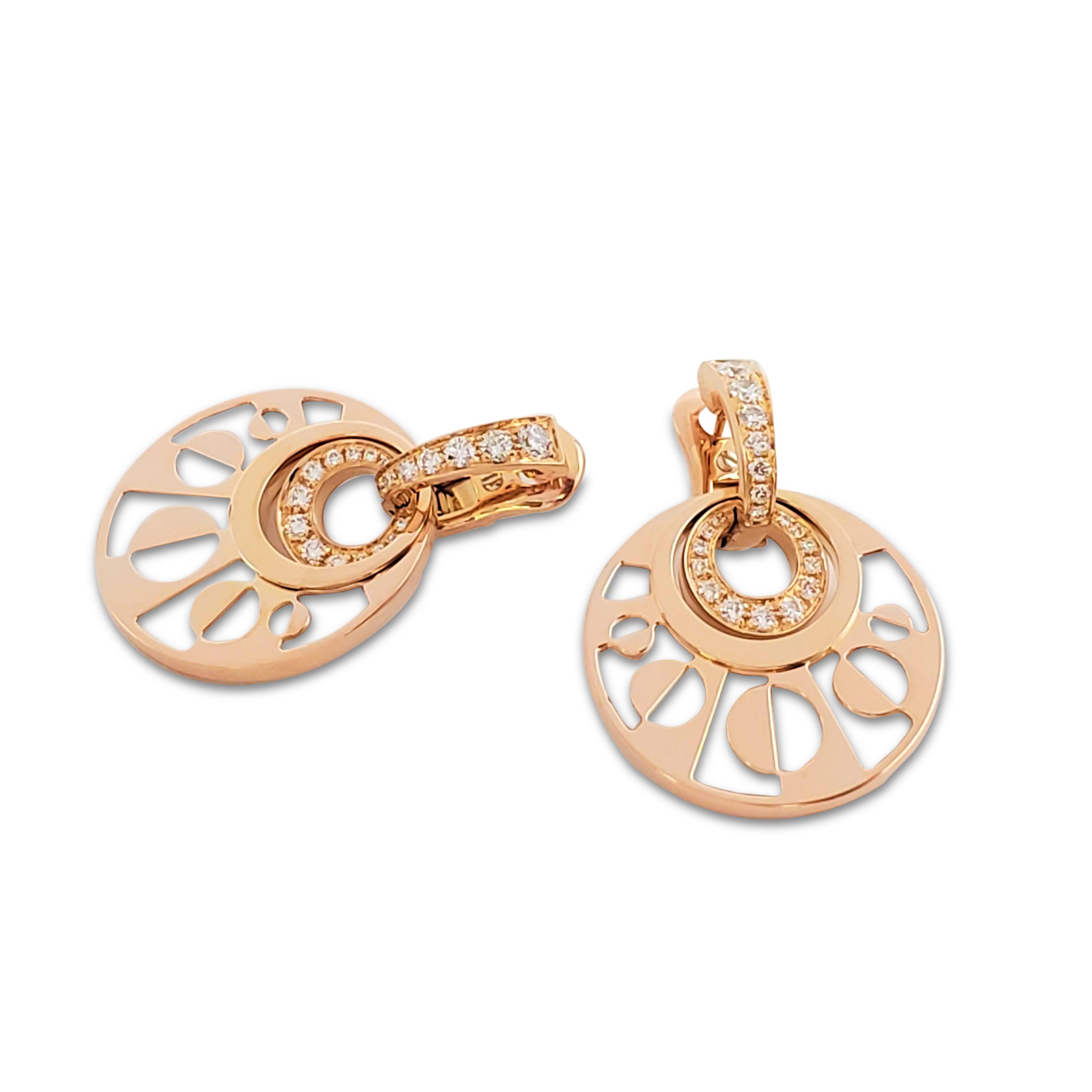Authentic elegant Bvlgari 'Intarsio' pendant earrings from the 'Mediterranean Eden' collection crafted in18 karat rose gold. The earrings center on round mother-of-pearl inlaid geometric motifs set with pavé round brilliant cut diamonds weighing an
