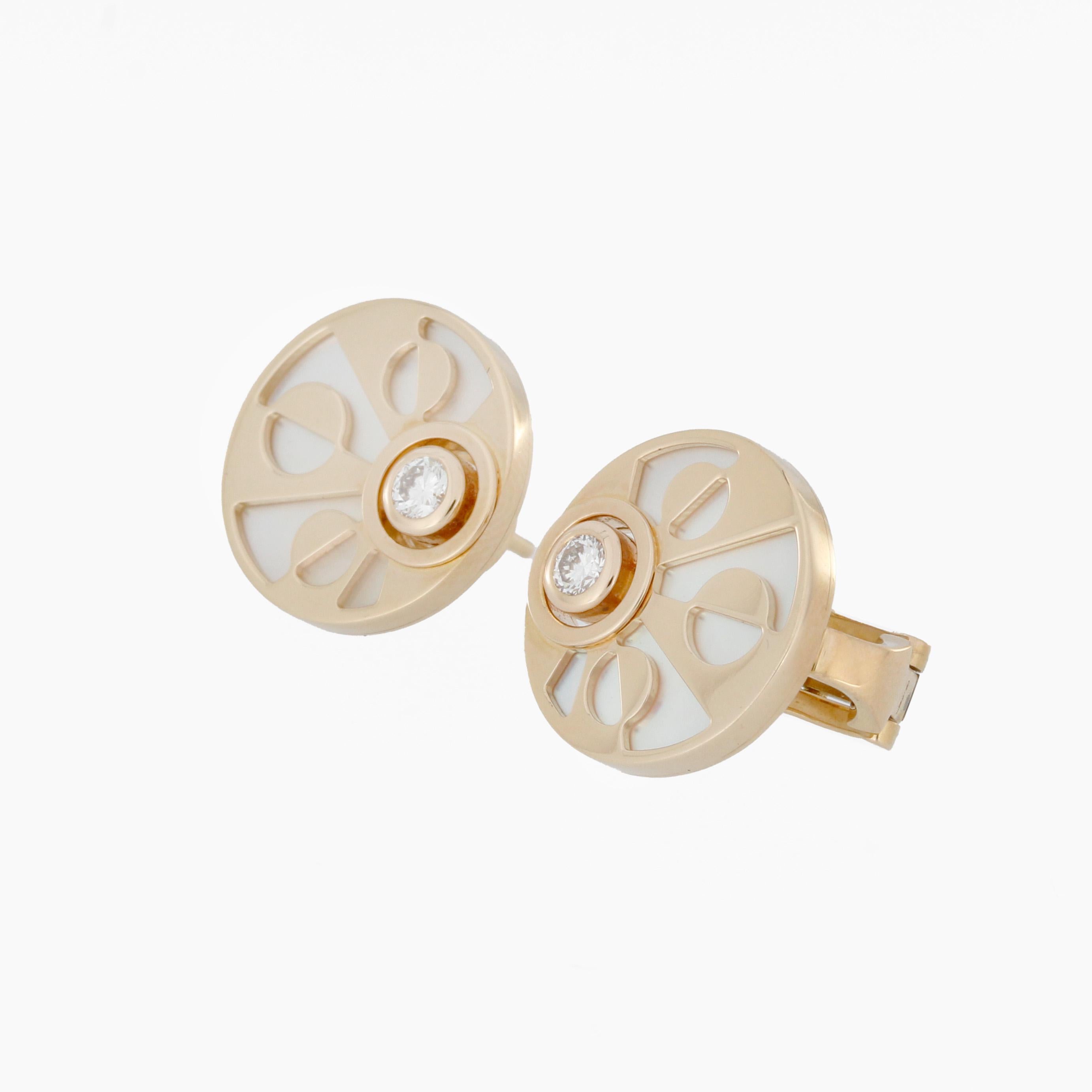 Bvlgari Intarsio Earrings in 18k rosegold and mother of pearl inserts.
2 Diamonds with a total of 0.21ct. Diamonds
Original Box & Certificate from 2013
