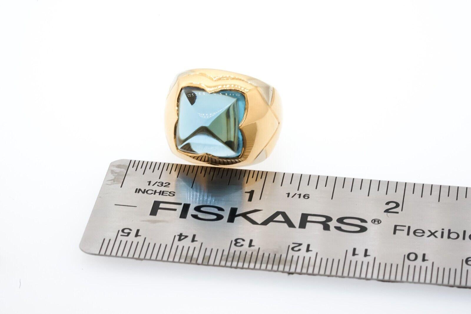 Bvlgari Italy 18k Gold & Topaz Pyramid Ring Vintage

Here is your chance to purchase a beautiful and highly collectible designer ring.  

STAMPED: 750 BVLGARI 
MEASURES:
Height: 0.4 Inches (10.2 mm)
Shank: 0.16 Inches (4.1 mm)
Width: 0.72 Inches