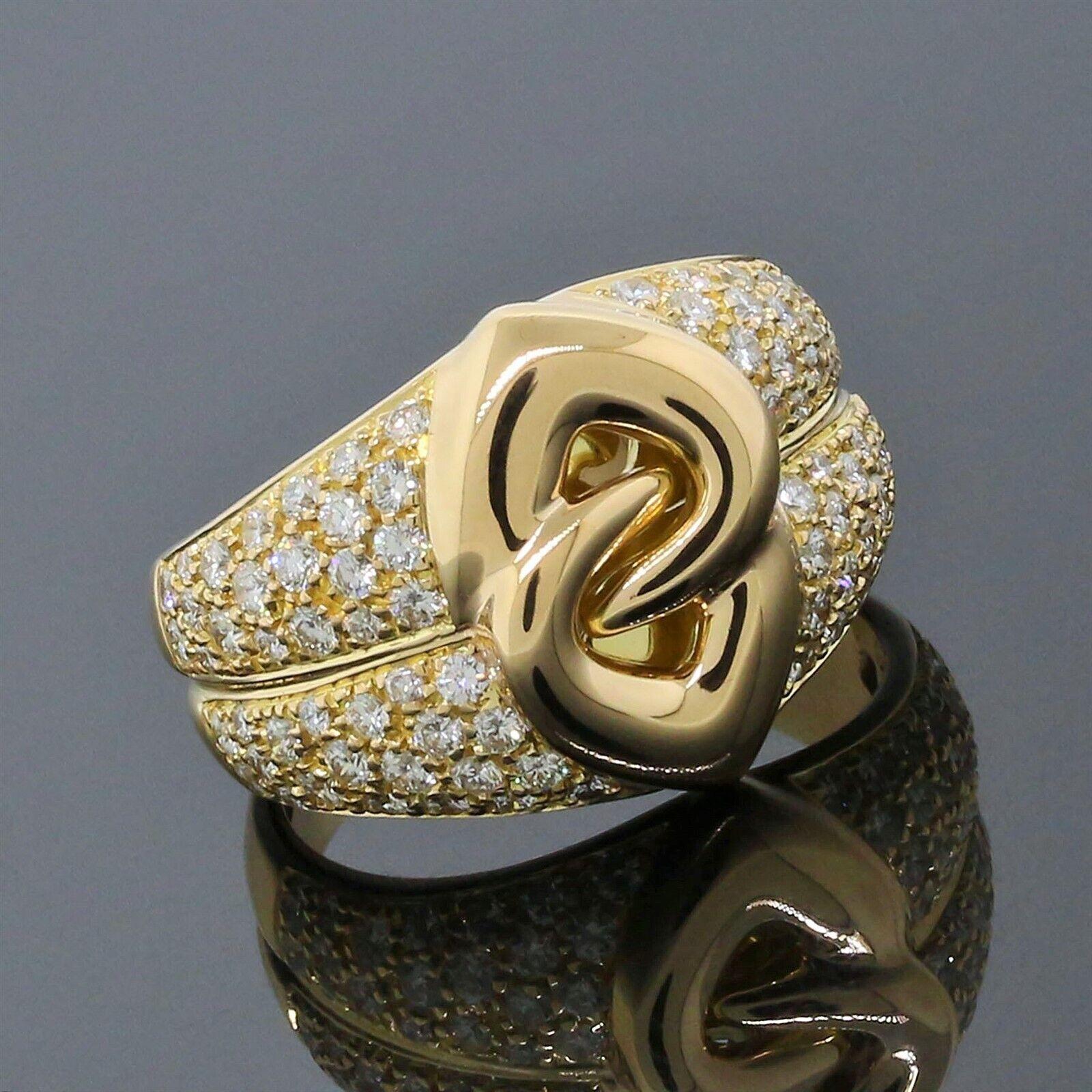 Bvlgari Italy 18k Yellow Gold & Diamond Interlocking Heart Ring w/Box

Here is your chance to purchase a beautiful and highly collectible designer ring.    

Authentic Bvlgari 18K Yellow Gold Double Heart Ring Size 8 1/2

Item Details:
The Ring