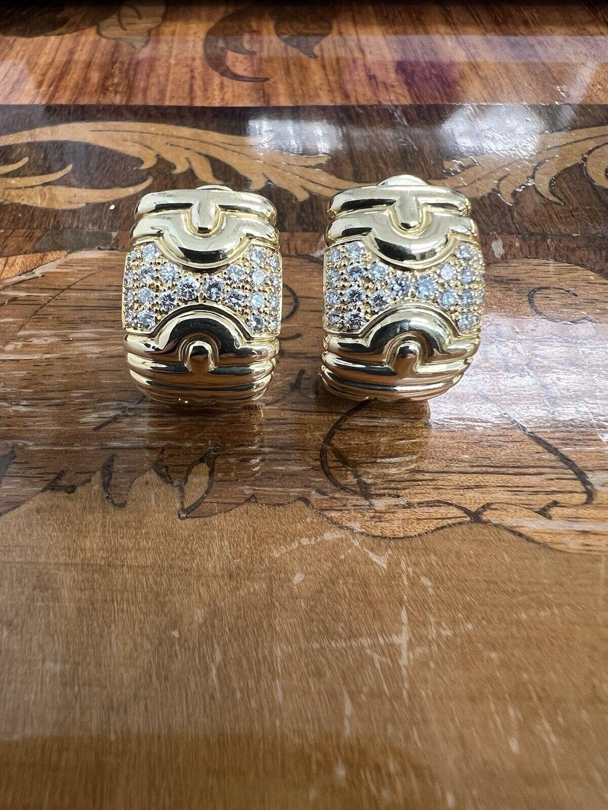 Bvlgari Italy 18k Yellow Gold & Diamond Parentesi Earrings Vintage 1980s

Here is your chance to purchase a beautiful and highly collectible designer pair of earrings.  Truly a great piece at a great price! 

Details:

These Bvlgari diamond earrings