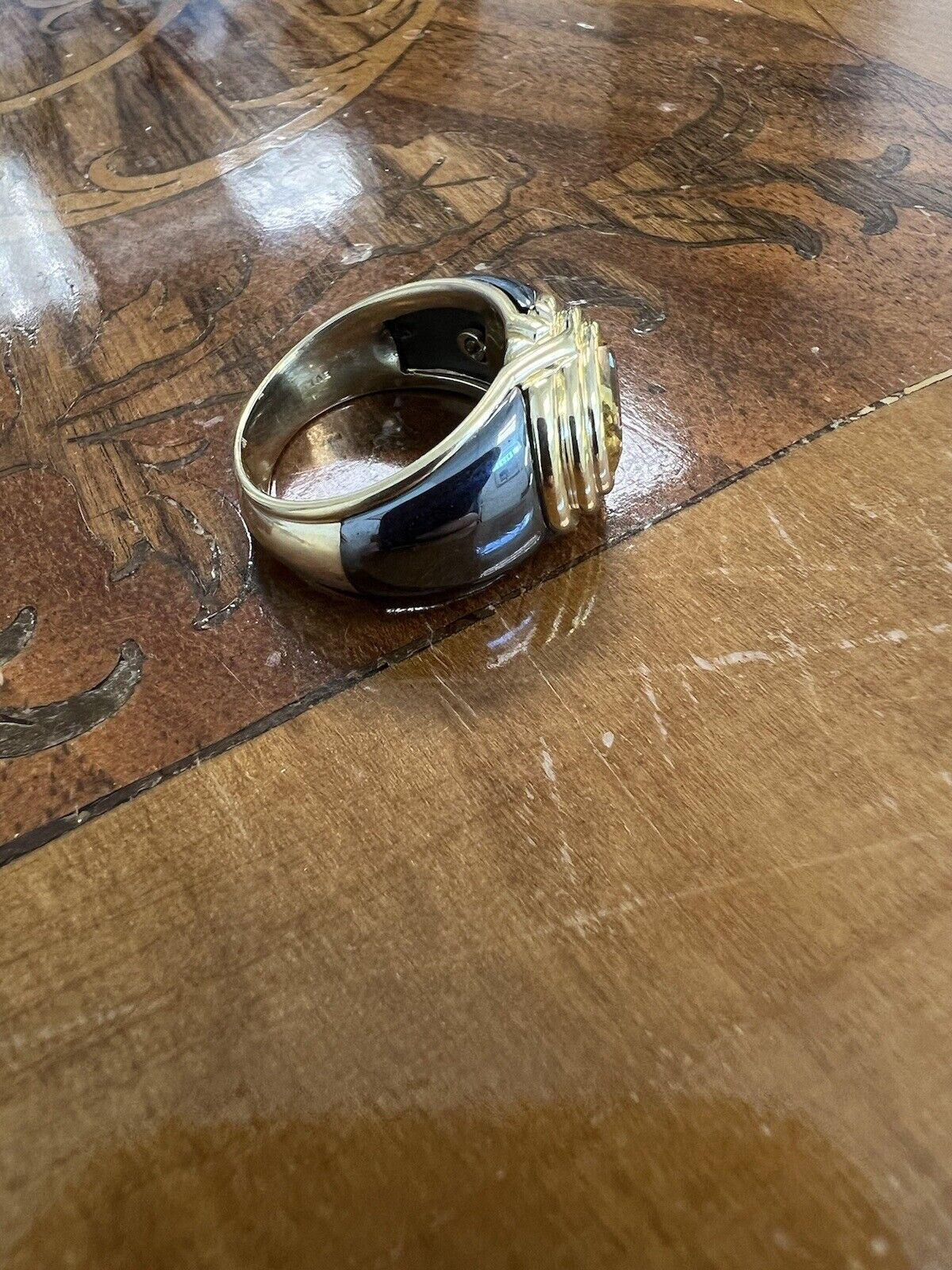 Bvlgari Italy 18k Yellow Gold, Hematite & Yellow Sapphire Ring Circa 1980s Vintage


Here is your chance to purchase a beautiful and highly collectible designer ring  Truly a great piece at a great price! 

Details:
The piece was created by Bvlgari