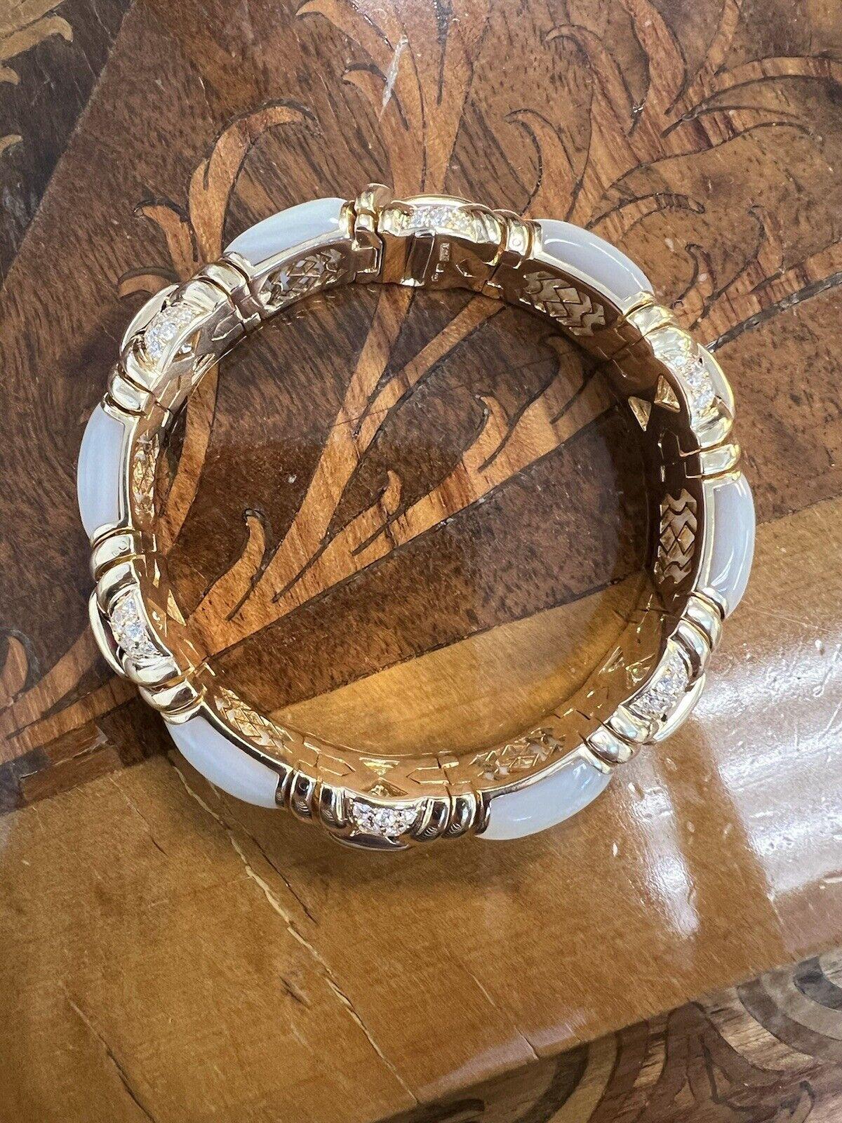 Bvlgari Italy 18k Yellow Gold, Diamond & Mother of Pearl Bangle Bracelet 1980s Vintage 

Here is your chance to purchase a beautiful and highly collectible designer bracelet.  Truly a great piece at a great price! 

Details:

Bvlgari Italy