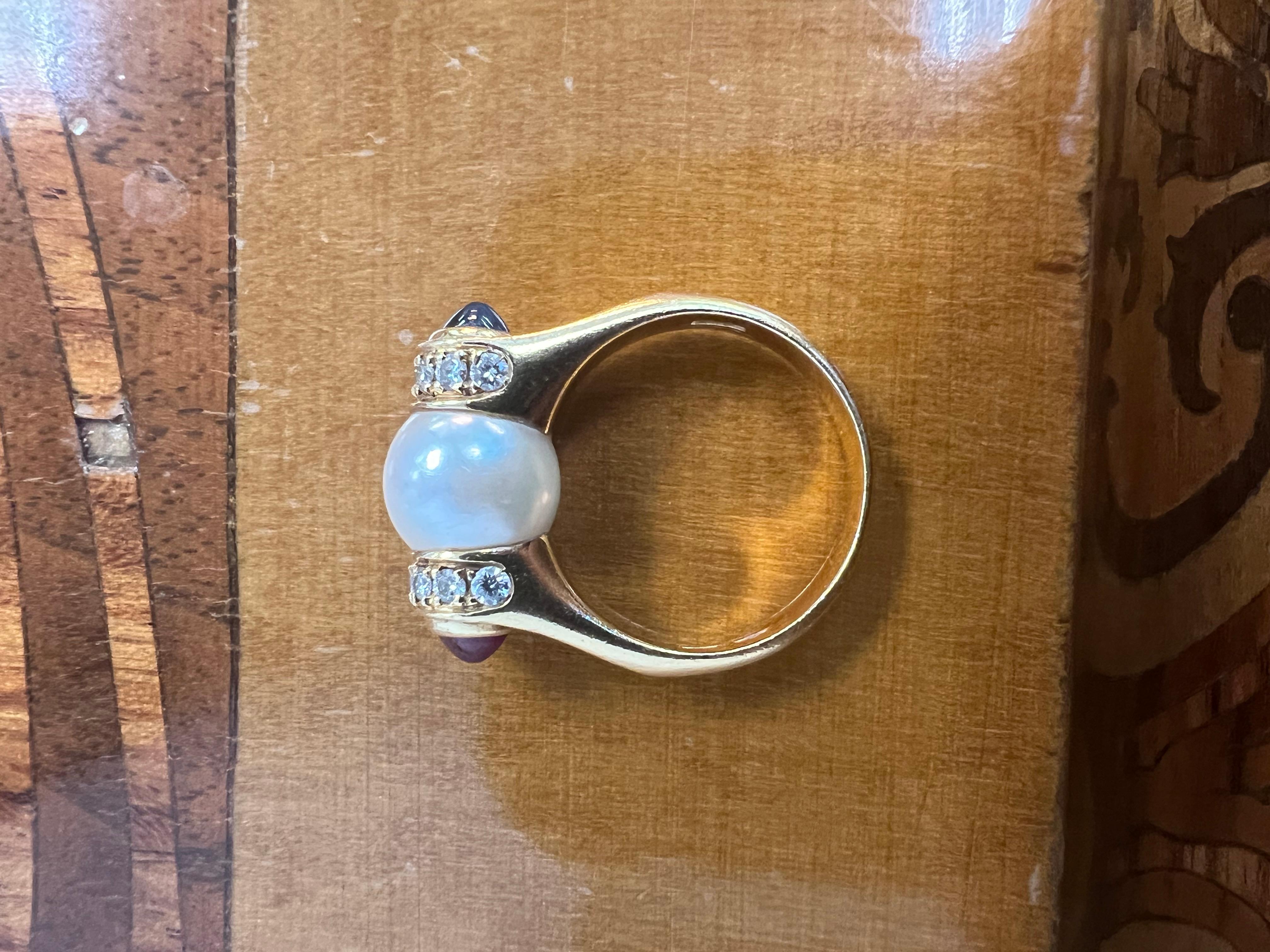 Bvlgari Italy 18k Yellow, Pearl, Diamond, Ruby & Sapphire Cocktail Ring 1980s Vintage




Here is your chance to purchase a beautiful and highly collectible vintage designer ring. 


Highly collectible and well-made vintage Bvlgari 18k yellow gold,