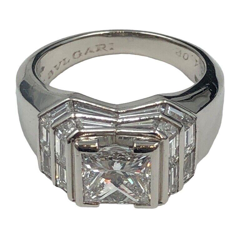 Bvlgari Italy Monture Platinum & Princess Cut / Baguette Cut Diamond Cocktail Ring 

Here is your chance to purchase a beautiful and highly collectible designer ring. Truly a great piece at a great price! 

Details:

Stone	diamond 1.02ct
Detailed