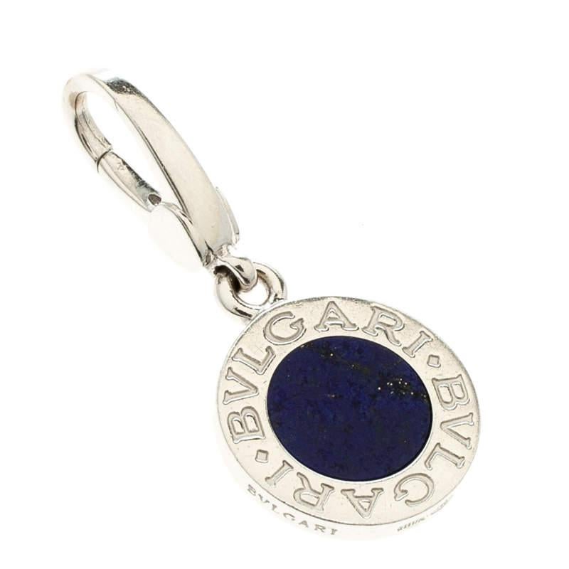 Weighing 3.70 grams, this charm pendant from Bvlgari is versatile as it comes with a lobster clasp which allows you to hook it to necklace chains or handbags. It has been crafted from 18k white gold and embedded with Lapis Lazuli and BVLGARI