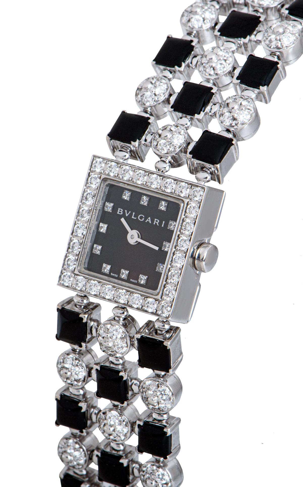 A 16 mm 18k White Gold Lucea Ladies Wristwatch, black dial set with 12 applied round brilliant cut diamond hour markers, a fixed 18k white gold bezel set with 28 round brilliant cut diamonds, 18k white gold case engraved with 