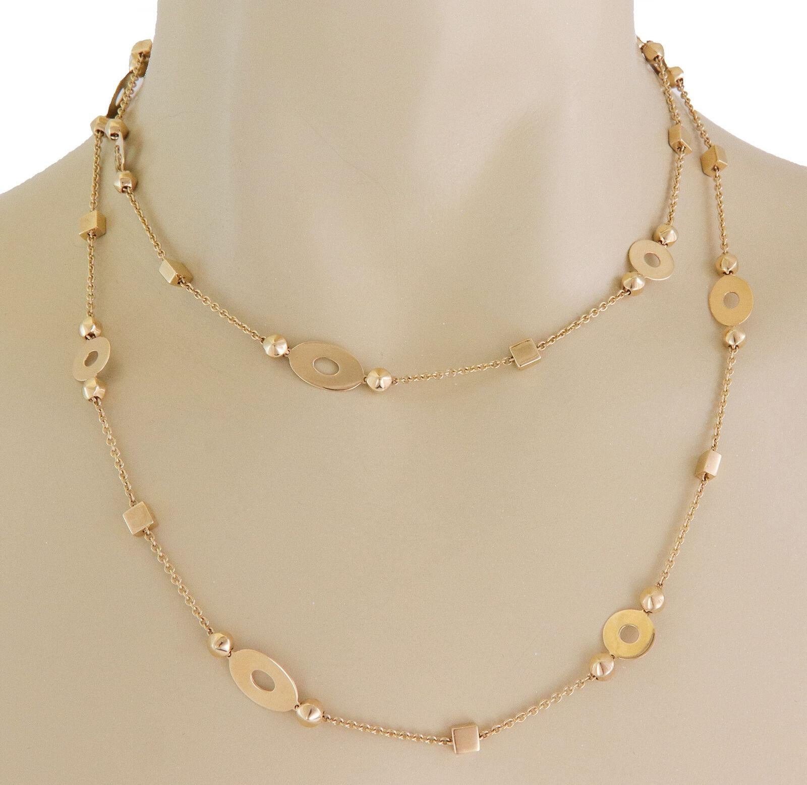 From the popular Lucia Collection by Bvlgari, this sophisticated authentic long necklace is crafted from 18k yellow gold with a high polished finish featuring classic style oval link chain with thin marquise, circle and cube shape motifs attached