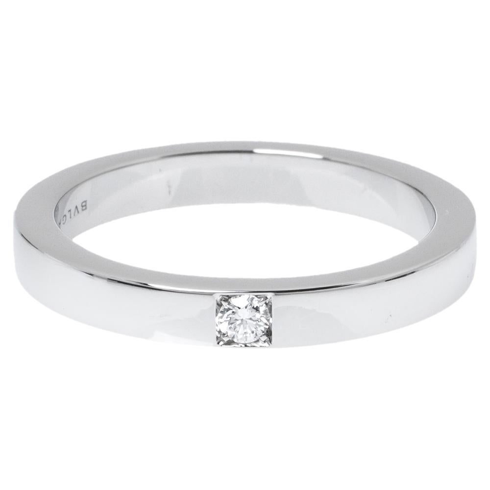 Clean cuts and a classic design make this beautiful Bvlgari MarryMe wedding band ring a must have for every newlywed or to be wed. Constructed in the luxurious platinum metal, this ring features a thicker rim that hugs your finger for comfortable