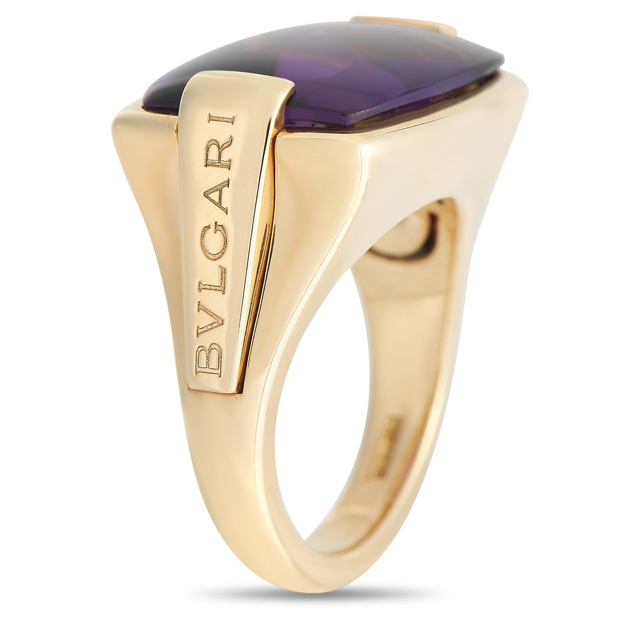 A stunning Amethyst gemstone sits at the center of this commanding ring from the Bvlgari Metropolis collection. The luxury brand’s signature is engraved on each side of the 18K Yellow Gold setting, which features a 3mm wide band and a 6mm top