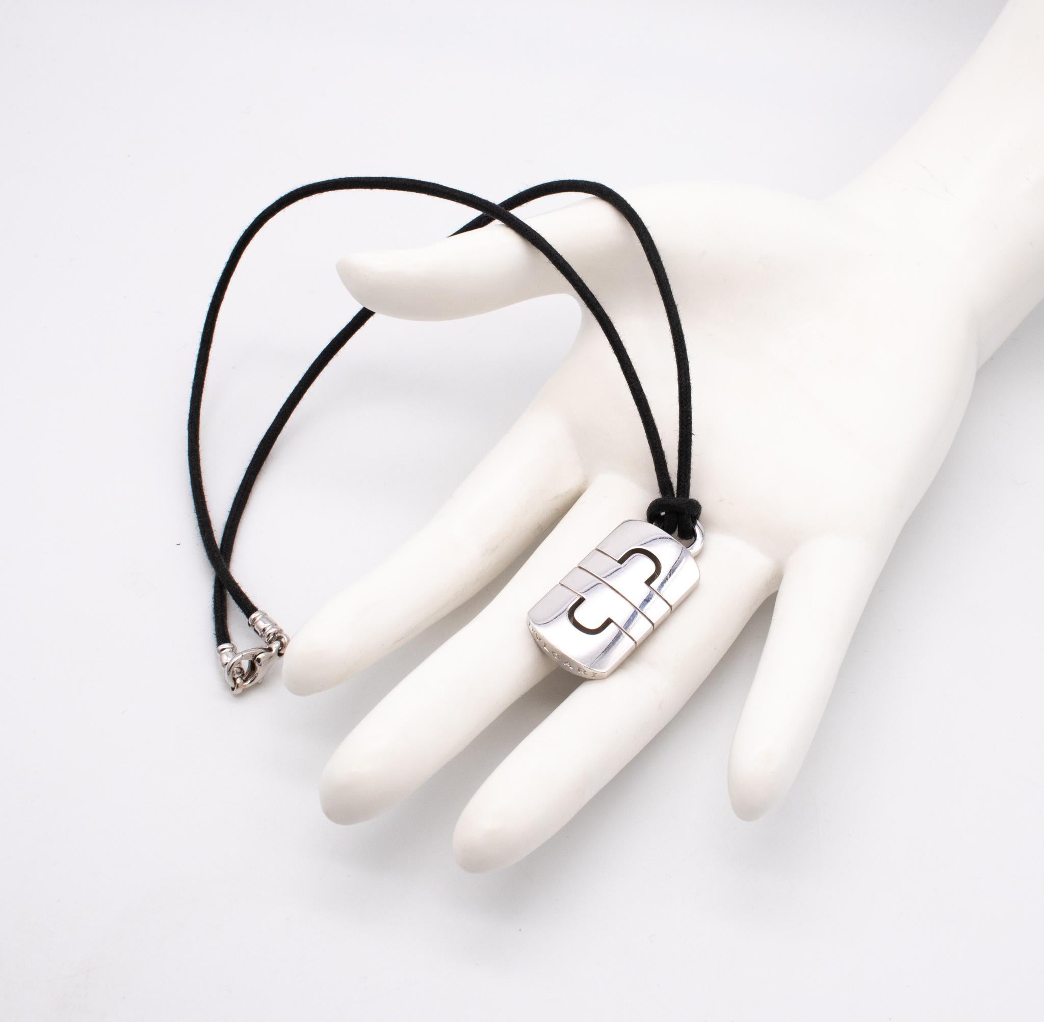 A Parentesi necklace designed by Bvlgari

 Modern unisex piece crafted in solid 18 karats white gold and finished, with high polished surfaces. Suited with a leathered cord and a white gold lobster locks.

From the Bvlgari, iconic Parentesi