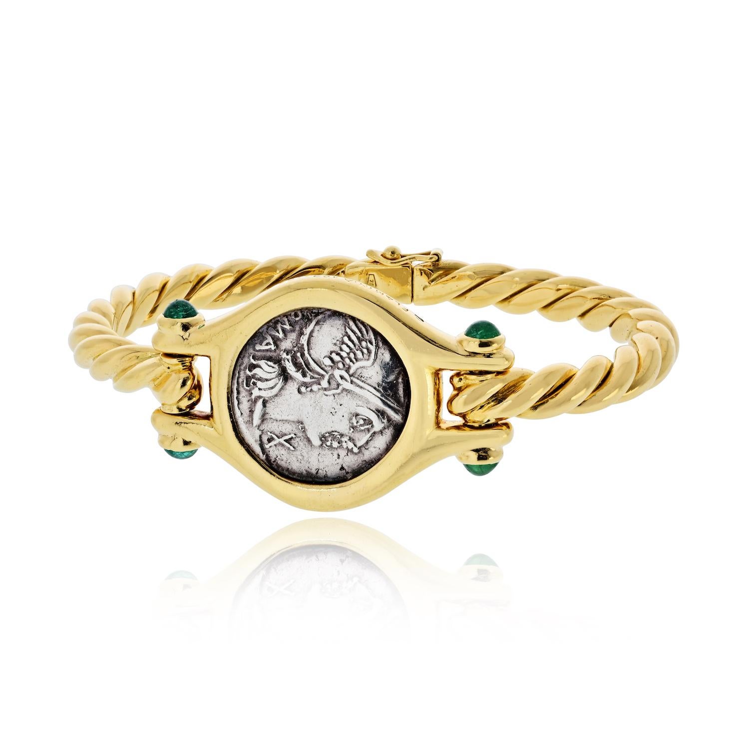 This vintage Bvlgari Monete bracelet is a striking example of the house’s iconic coin jewelry, celebrating history through modern Roman craftsmanship. Handmade in 18K yellow gold, the bangle centers an authentic ancient coin of Flaminia (109–108