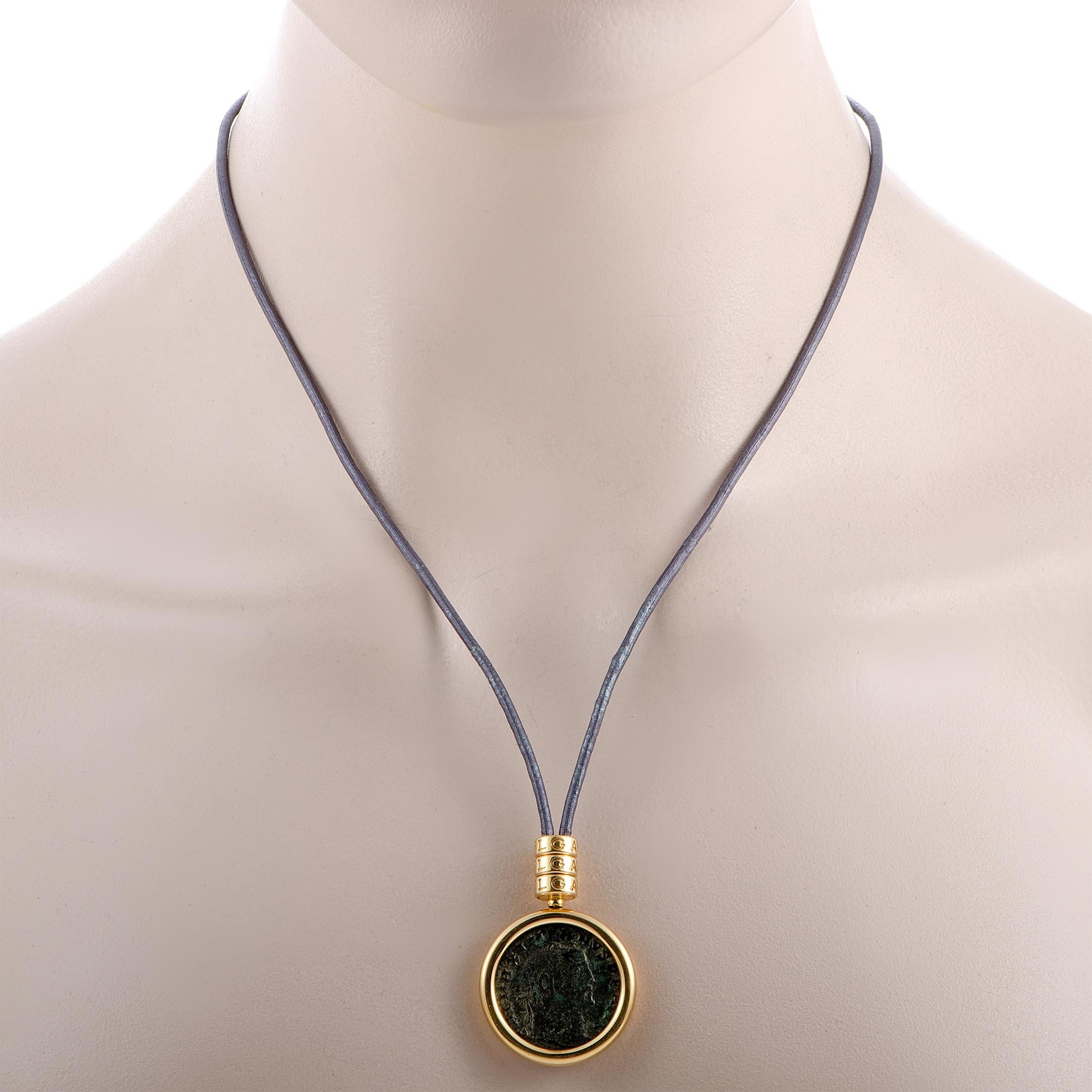 The Bvlgari “Monete” necklace is presented with a 25” cord onto which a 1.55” by 1.15” pendant is attached – set with an antique coin. The necklace weighs 25.8 grams.

This jewelry piece is offered in estate condition and includes the manufacturer’s