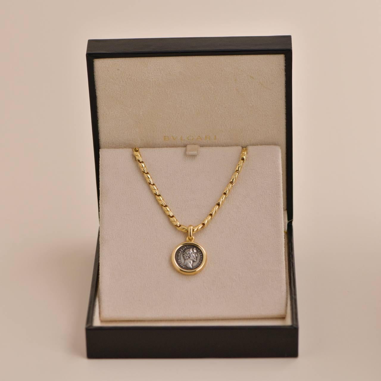 *Rare Find* This fabulous Bvlagri Monete pendant is crafted in 18K yellow gold set with a unique ancient Roman coin. The back of the coin is inscribed GORDIANUS AUG
AD 230-244. Stamped Bvlgari. Made in Italy. Monete is one of Bulgari's signature