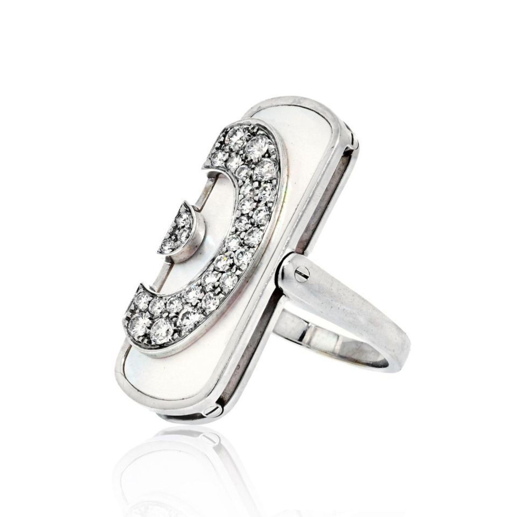 This beautiful Bvlgari ring showcases pave set round brilliant cut diamonds mounted over grey mother of pearl making it a perfect gift for a mother, anniversary, holiday or just a party. Crafted in 18k white gold. This exciting and unique design