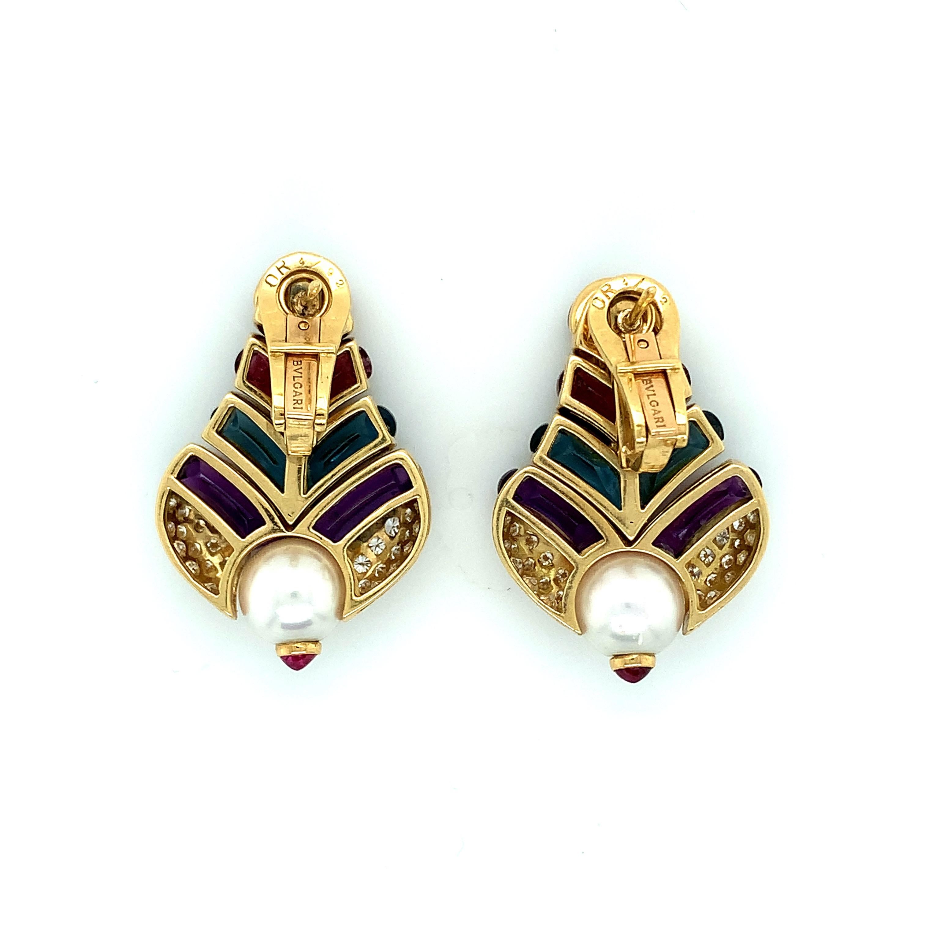 Bvlgari 18 karat yellow gold dangling earrings with multi-color stones, including amethyst, blue topaz, tourmaline, citrine, pearl, and diamond. The diamonds weigh approximately 1 carat. Circa 1970s. Marked: Bvlgari / 750. Total weight: 27.6 grams.