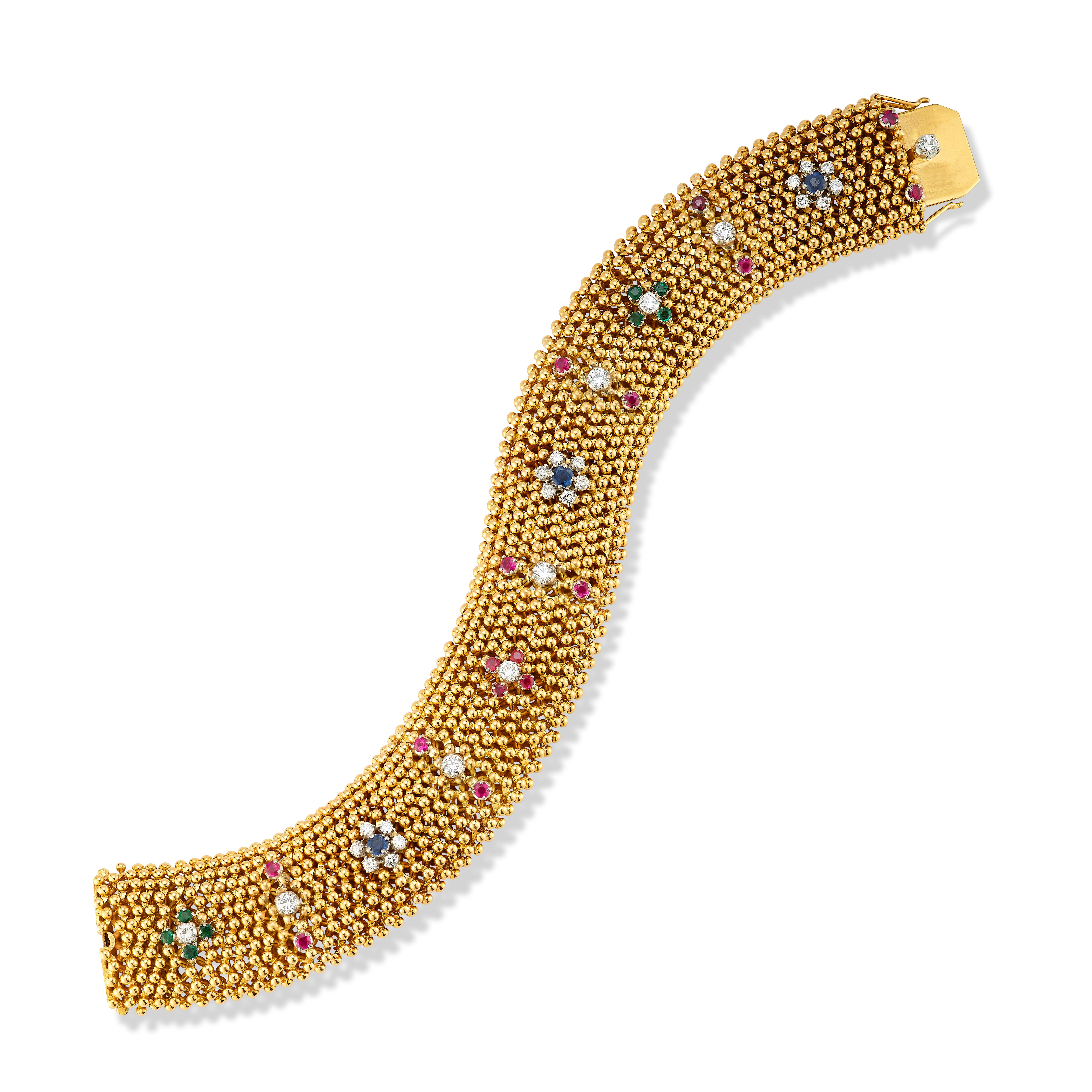Bulgari Multi Gem Gold Bracelet

An 18-karat yellow gold mesh bracelet set with round cut diamonds, rubies, emeralds, and sapphires in a repeating pattern

Signed Bvlgari
Stamped 750

Total Approximate Diamond Weight: 1.5 carats
Total Approximate