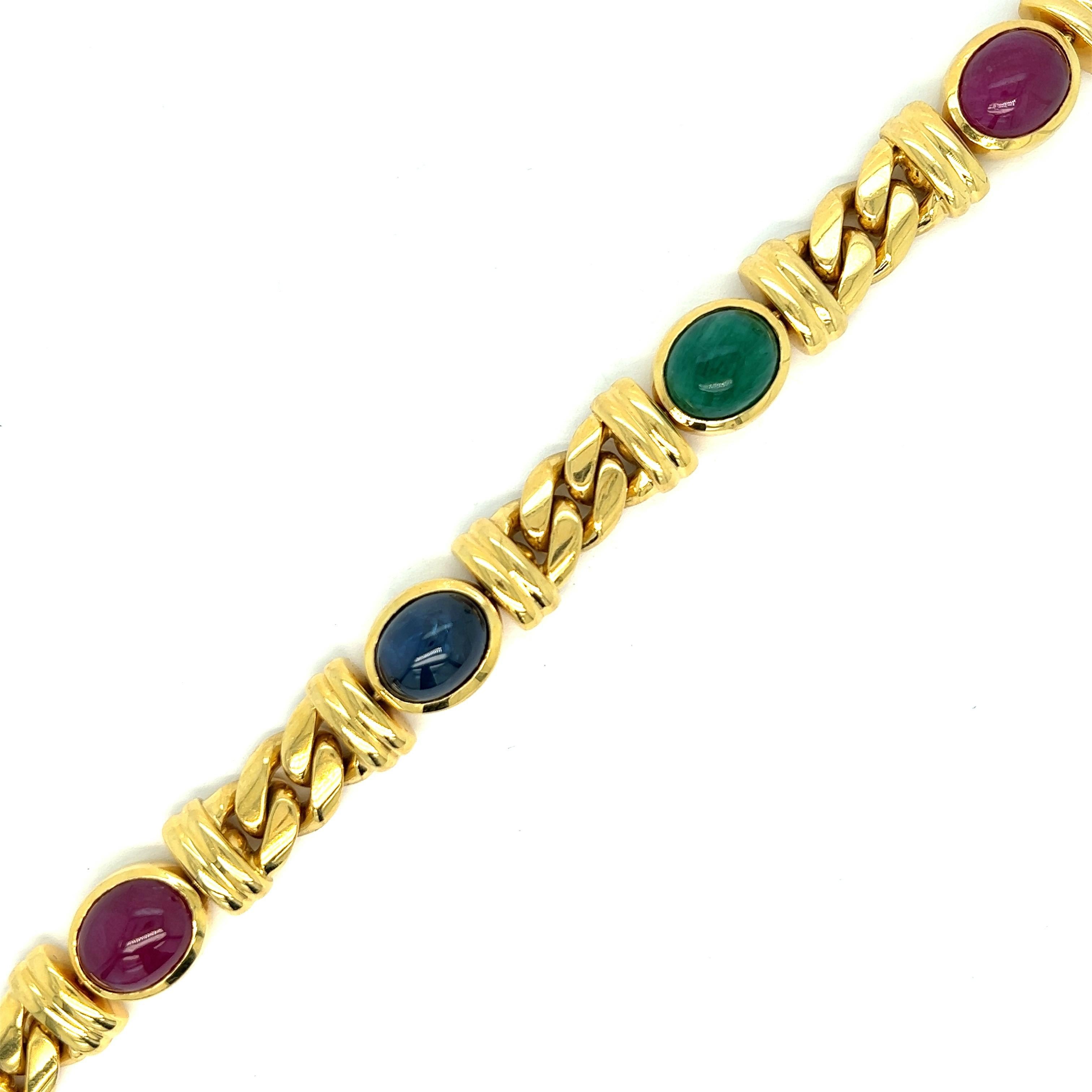 Bvlgari multi-gem gold link bracelet 

Cabochon emerald, sapphire, and rubies of approximately 30 carats total; each one measures 11 x 9 mm; 18 karat yellow gold; marked Bvlgari, 750

Size: width 0.5 inch, length 7.88 inches
Total weight: 87.3 grams