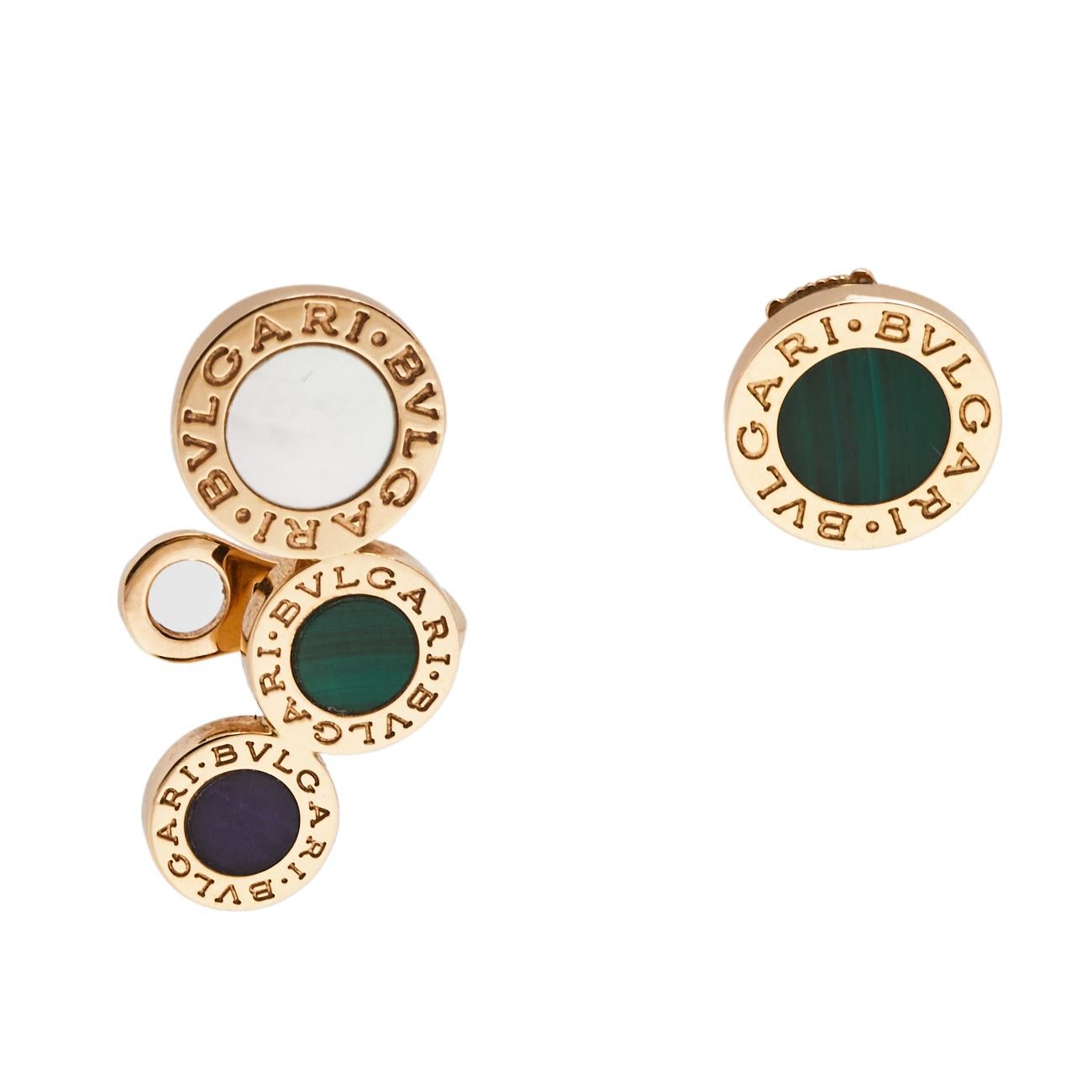 From the brand's iconic BVLGARI BVLGARI collection comes this et of two single earrings. One of the earrings is designed as an assortment of three graduating coin motifs engraved with the label on the contours and inlaid with stones. The other