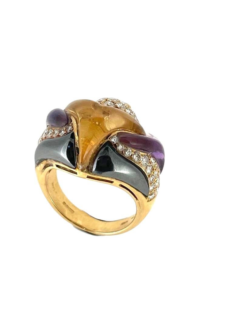 Bvlgari rare 18K gold, tourmaline, hematite, and pave diamond ring from the Naturalia collection in a stylised  fish shape with diamond eye accents.
Make in Italy. viva 1980
Size is 51 (Size can be altered)