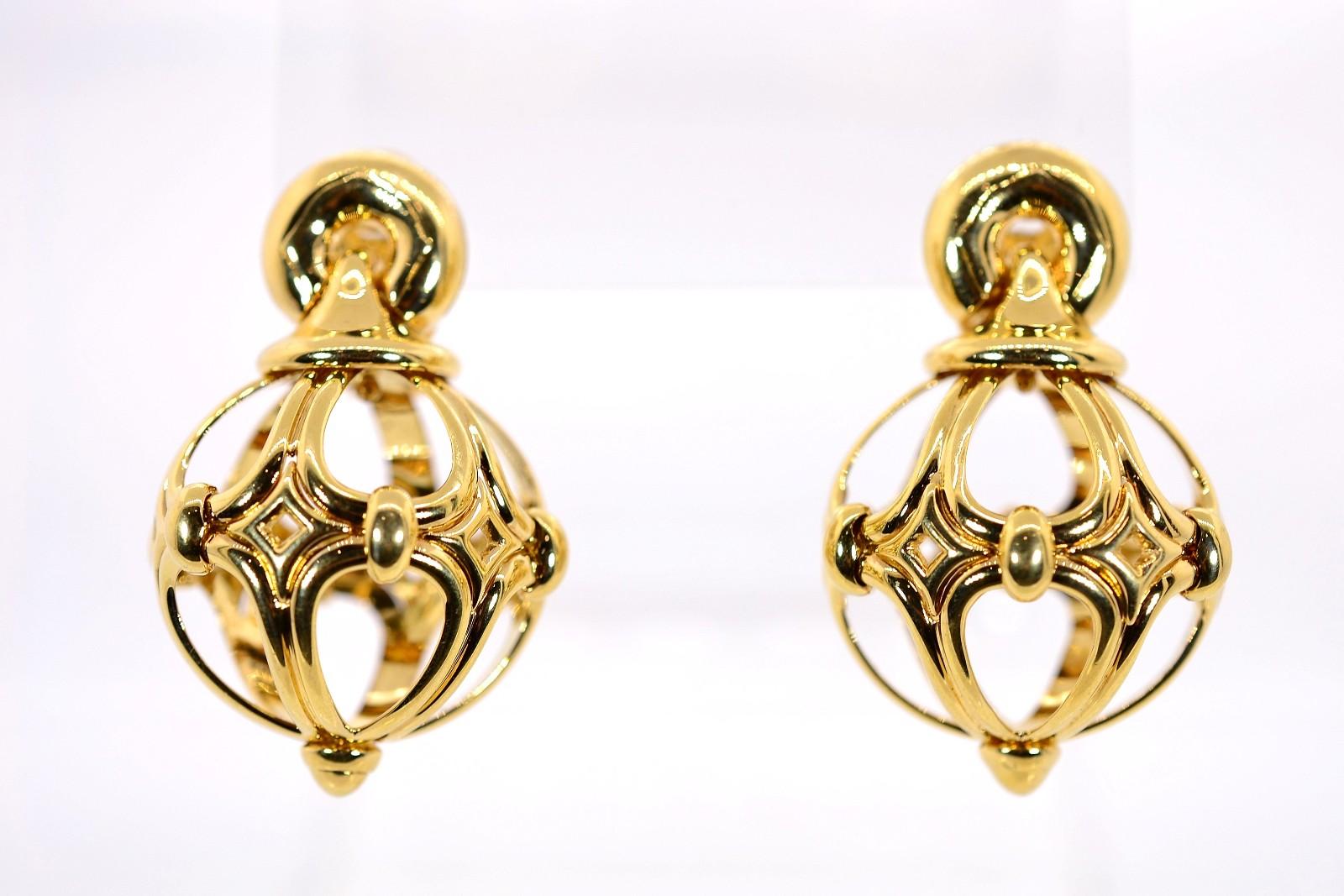 From the last ten years come these Bvlgari 18KT yellow gold earrings.  Designed as open work spheres resembling 19th century hot air balloons, these have a soft 360 degree spin movement; they dangle from a rounded finial cup and are completed with a