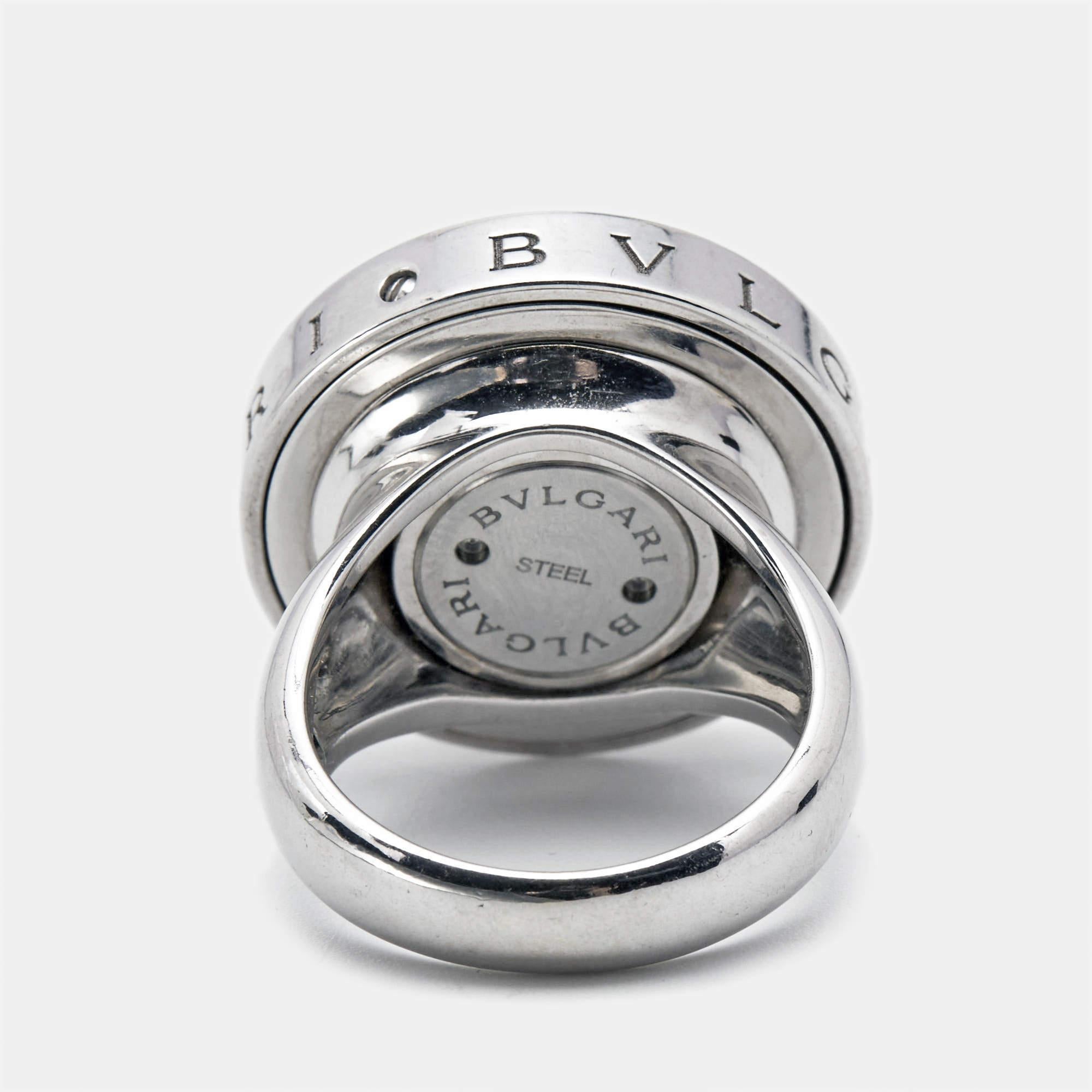 Experience the epitome of luxury and craftsmanship with this meticulously designed Bvlgari ring. Its timeless elegance and exceptional detailing make it a statement piece for any occasion.

Includes: Original Box, Original Case (Damaged);