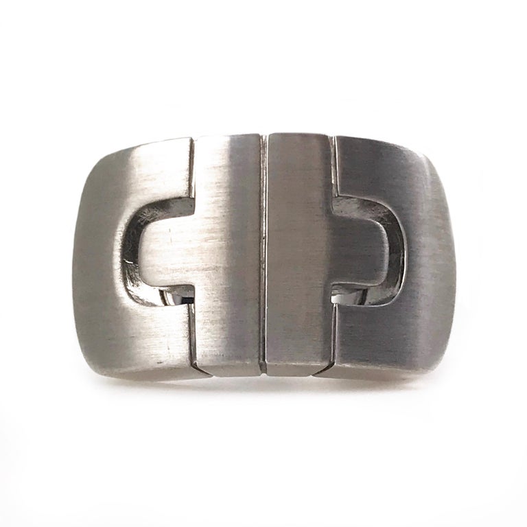 Bvlgari Parentesi 18 Karat White Gold. This ring from the House of Bvlgari is designed with a bold geometric motif on top that has a satin finish, the remainder of the ring has a sleek, smooth finish. The maker's mark inside the band reads 750 Italy