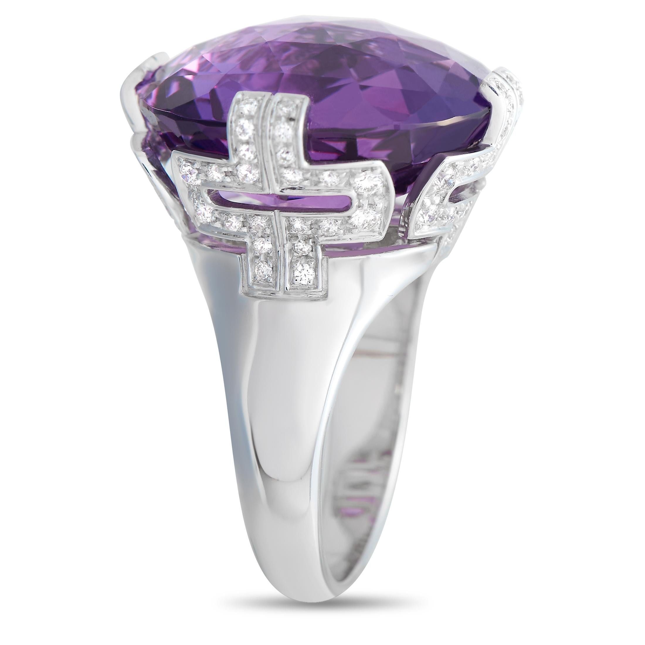 A breathtaking Amethyst gemstone makes a statement at the center of this exquisite Bvlgari Parentesi ring. On the sides, the sleek 18K White Gold setting is also elevated by glittering diamond accents totaling 0.70 carats. This piece possesses a 3mm
