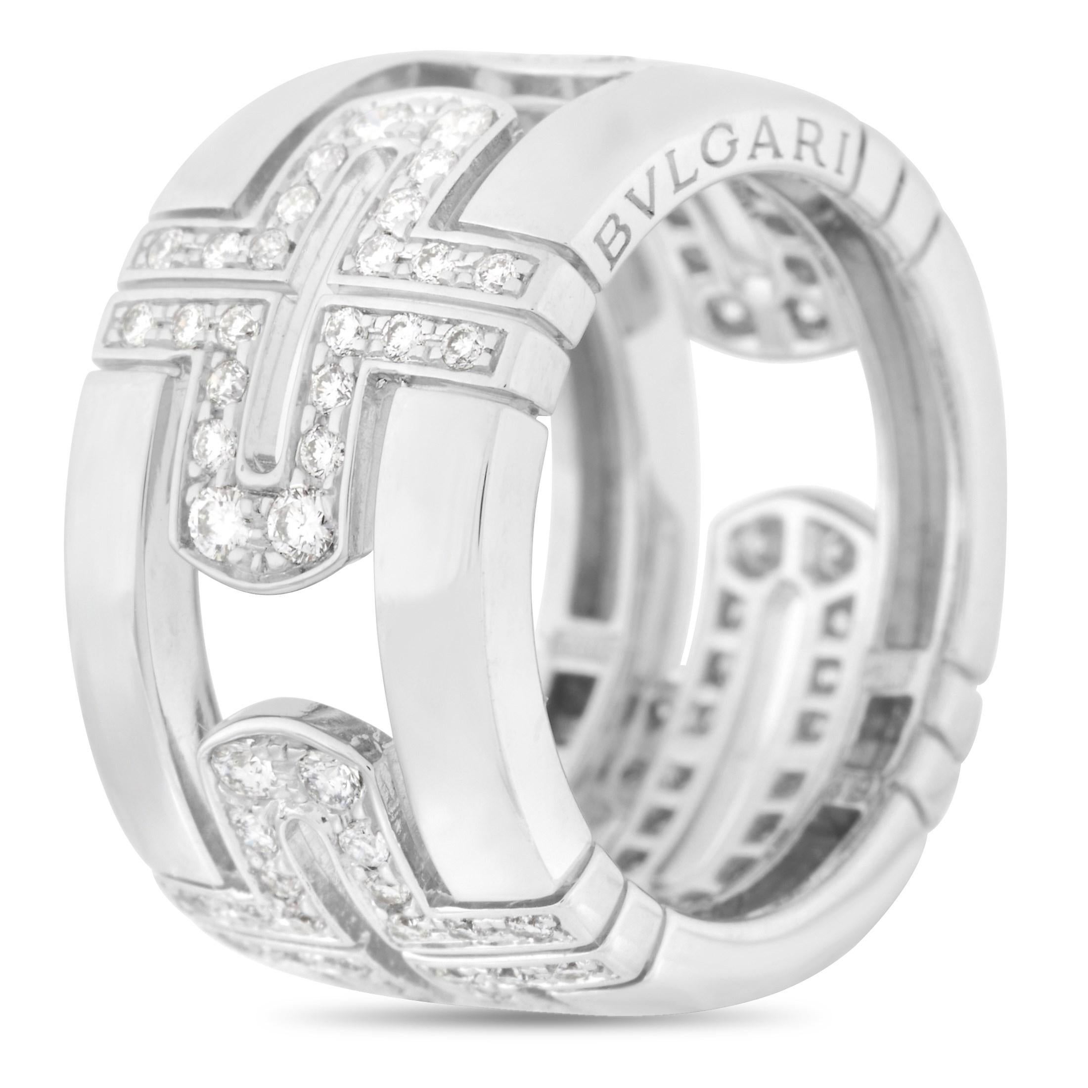 This Bvlgari Parentesi 18K White Gold 0.70 ct Diamond Cross Ring is made with 18K White Gold. The band measures 11 mm and features an open cross design around it, set with 0.70 carats of round cut diamonds with F color and VVS clarity. The band is