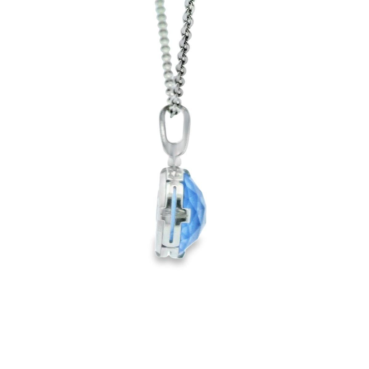 This timeless pendant from the Parentesi Cocktail Collection from BVLGARI is offered by Alex & Co. This 18K white gold classic piece delivers a modern attitude and features a striking round faceted checkerboard cut blue topaz weighing 9.60ct,