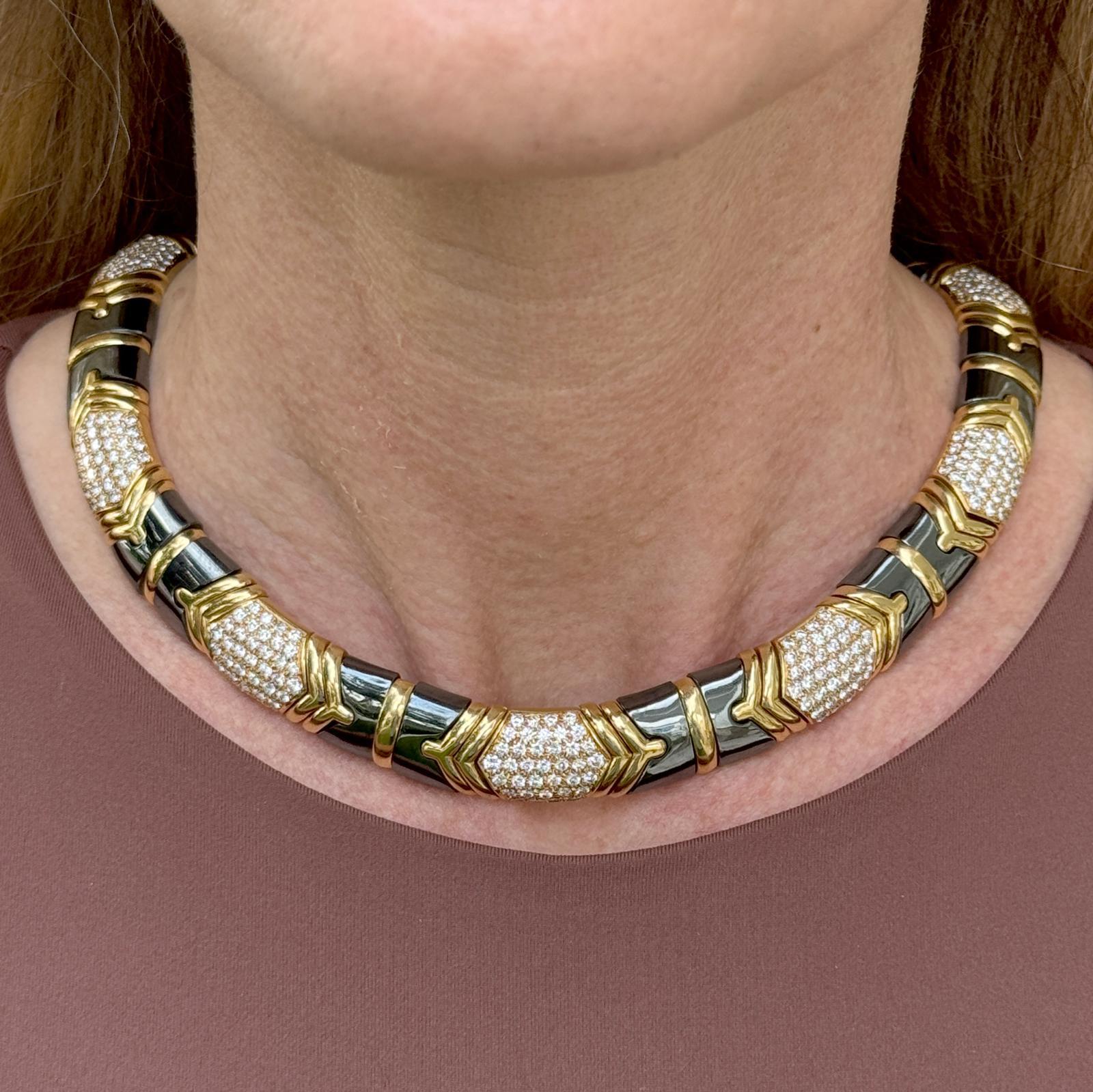 This vintage 18-karat yellow gold Bvlgari Parentesi collar necklace features a sophisticated design with 12.5 carats of sparkling diamonds and rich hematite accents. The necklace is crafted with Bvlgari's signature Parentesi motif, which consists of