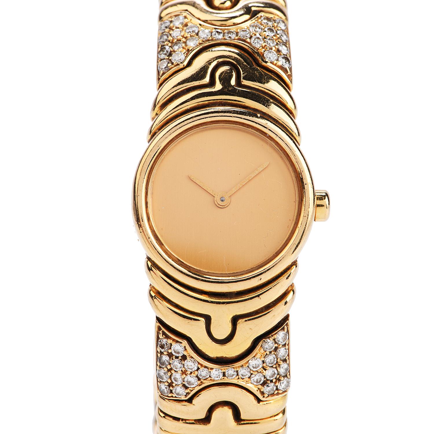 Ladies 18k yellow gold and diamond Parentesi bangle bracelet watch by Bvlgari. This stylis Bulgari ladies watch of unique feminine appeal is adorned on the bangle bracelet with  approx 2.50 carats of finest quality original factory set brilliant-cut