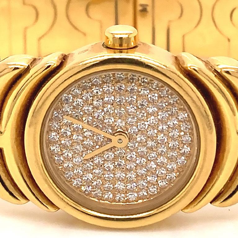 Authentic Bvlgari Parentesi ladies bracelet watch in 18k yellow gold, Ref. BJ 01. This stunning watch features a 20mm 18k gold case with closed solid snap back. The watch has an gold dial Pave' set with diamonds covering the whole face and yellow