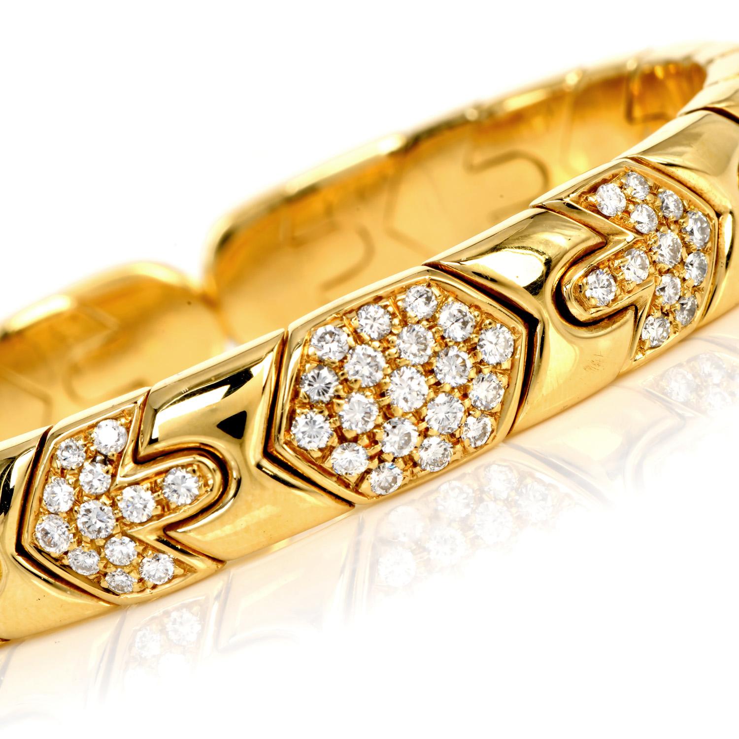 A top Quality masterpiece from the Bvlgari house.

This 1980's bangle flexible link cuff bracelet is crafted 18K yellow gold, weighing approximately 58.5 grams.

The center cluster style links features (45) Genuine dazzlings Diamonds round-cut,