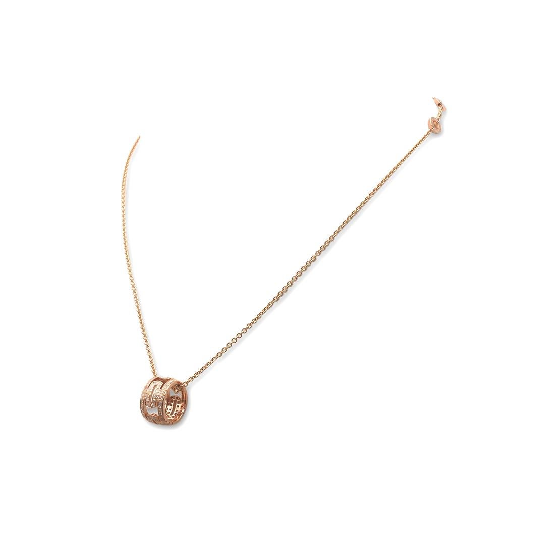 Authentic Bvlgari 'Parentesi' necklace crafted in 18 karat rose gold. The pendant is inspired by Rome's architecture and set with an array of round brilliant cut diamonds weighing an estimated 0.70 carats (G-H color, VS Clarity). The necklace is